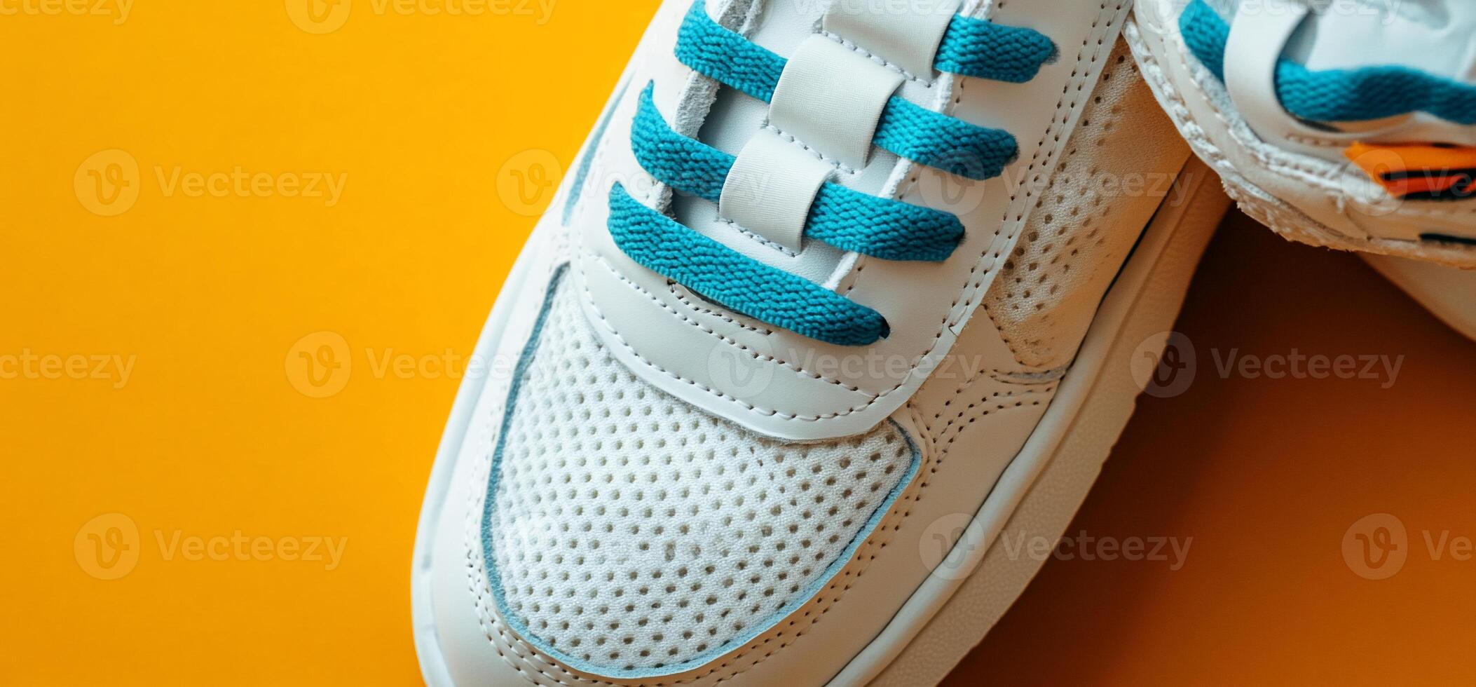 Stylish white sneakers with teal laces photo