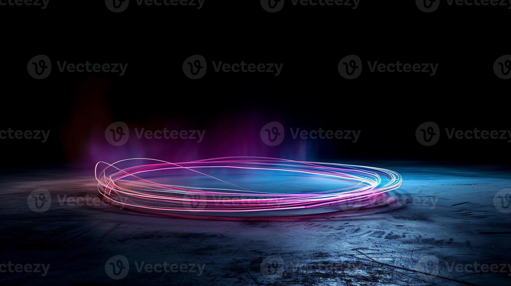 Abstract neon light circle on dark textured surface photo