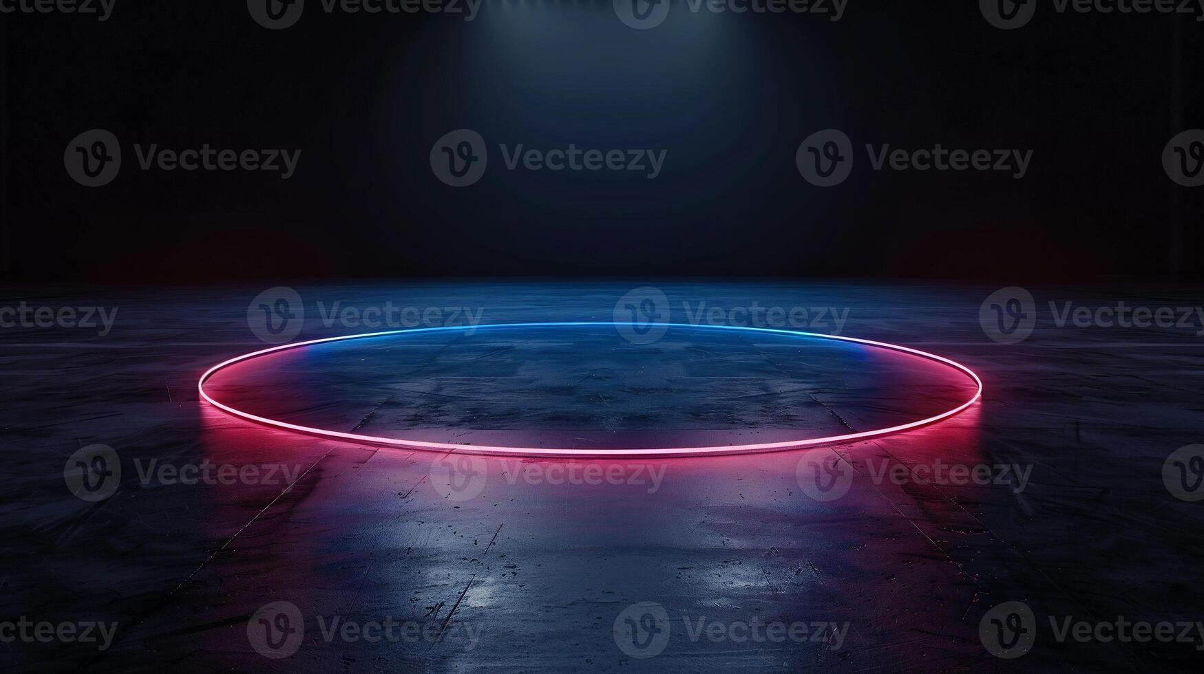 Neon circle on dark concrete floor photo