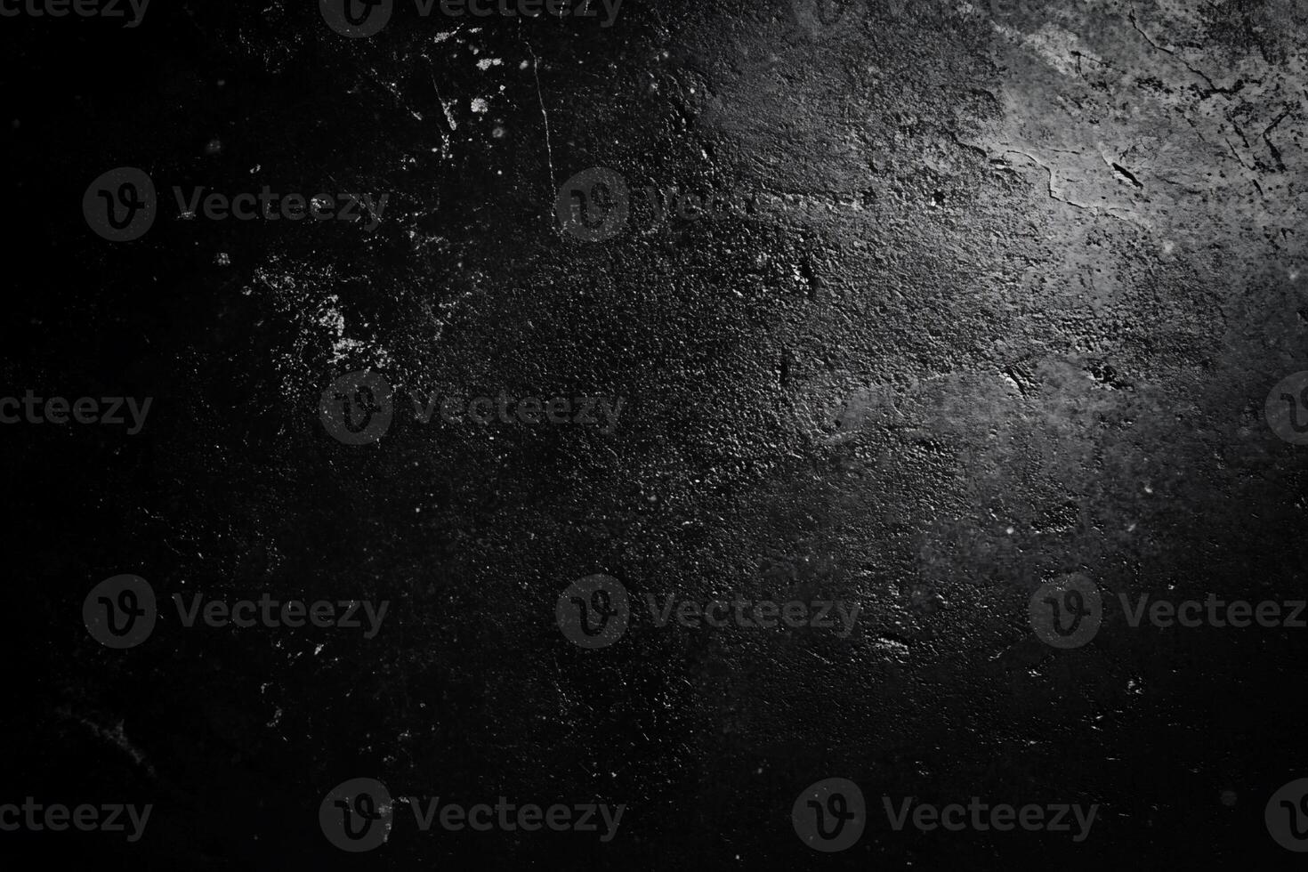 Dark, textured surface with a shadowy light photo
