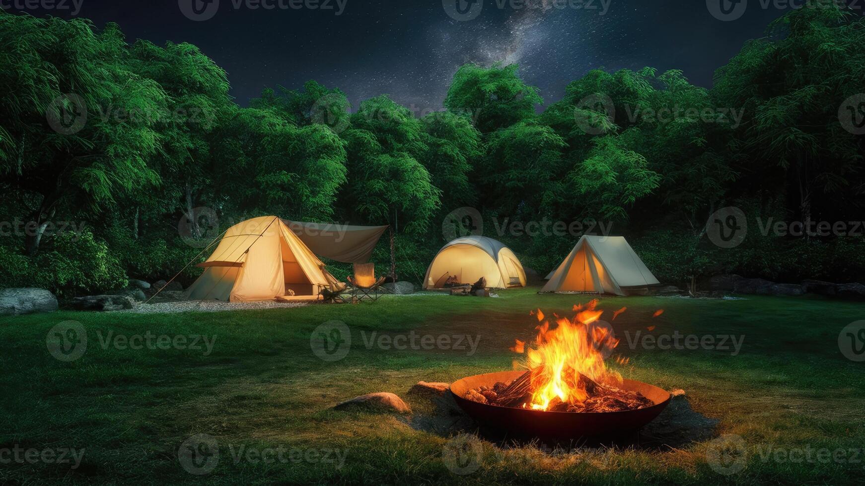 The charming night view reflects the essence of a peaceful campsite nestled in a lush and green forest photo