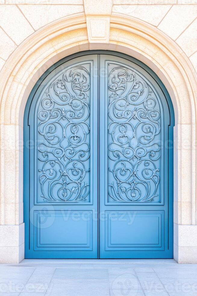 Gray arched door with intricate ironwork adorning a European stone building in a picturesque architecture setting photo