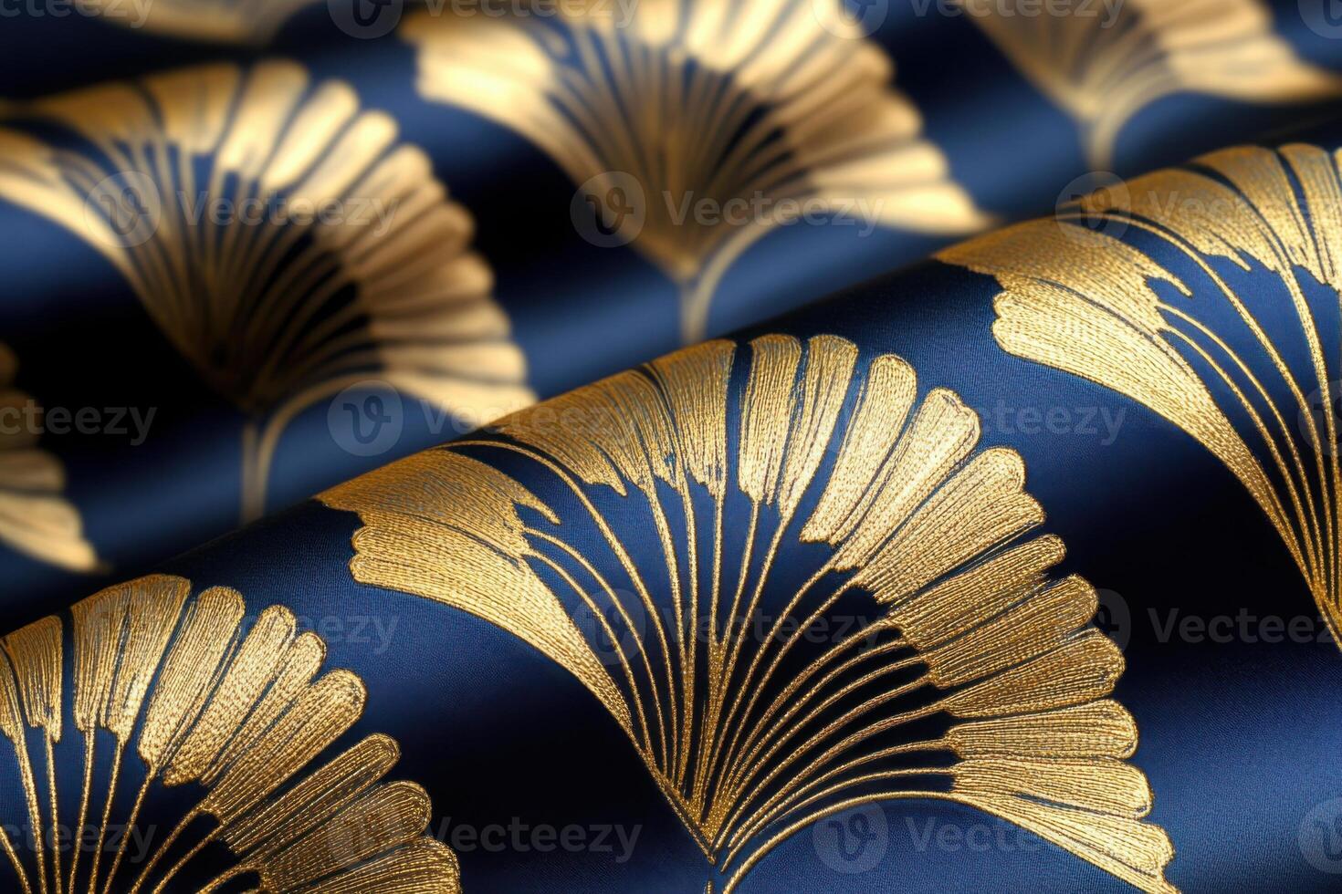 Decorative fabric with gold art deco motifs on navy background captures light in an elegant arrangement showcasing its intricate design photo