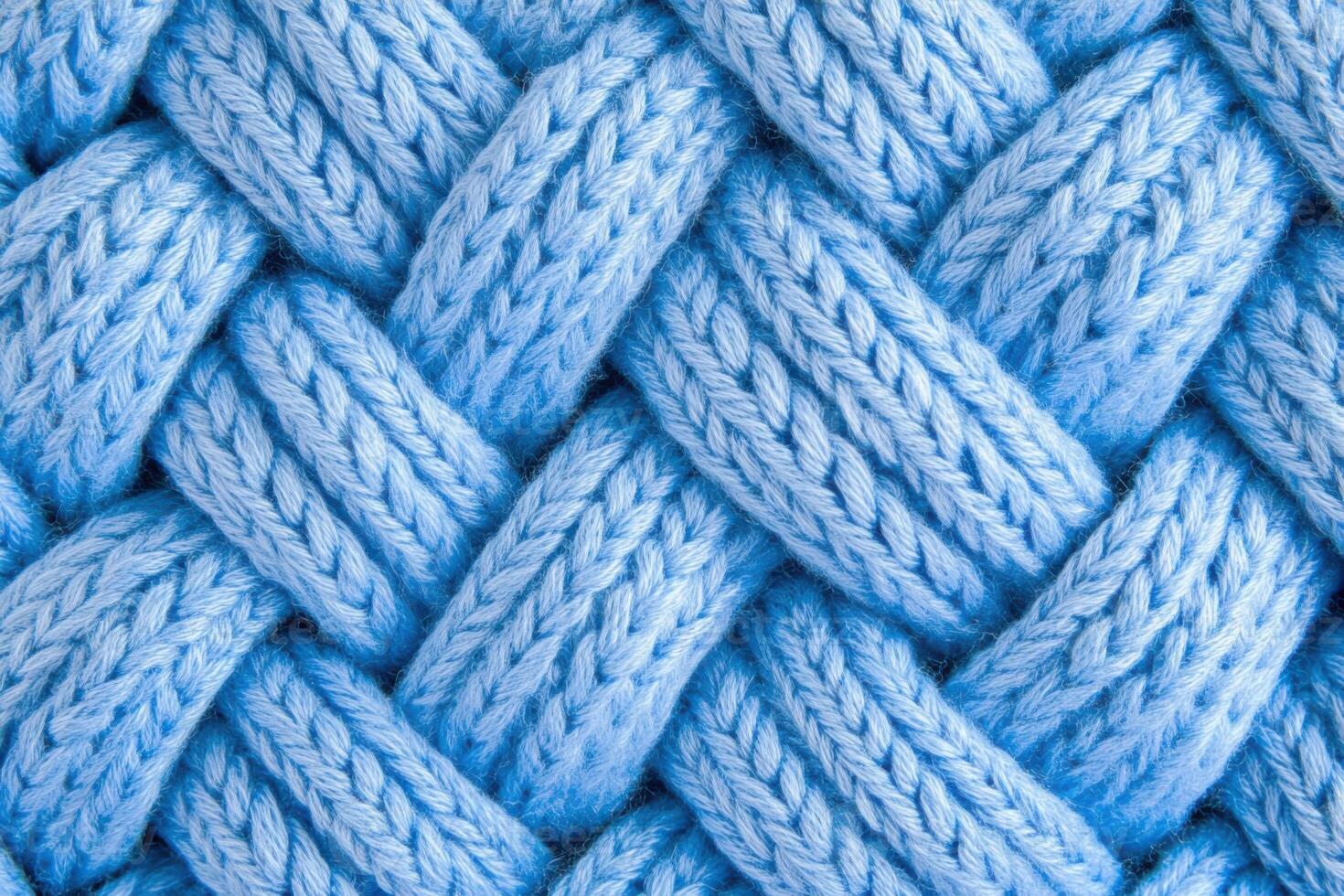 Hand-knitted blue cable knit fabric showcasing intricate texture and pattern in Pantone Little Boy Blue suitable for cozy creations photo