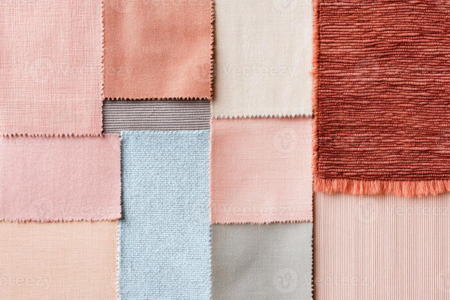 Layered pastel textiles and handmade paper samples in soft shades create an artistic tactile composition photo