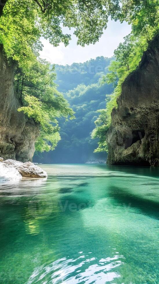 Pristine river flowing through green canyon in japan photo