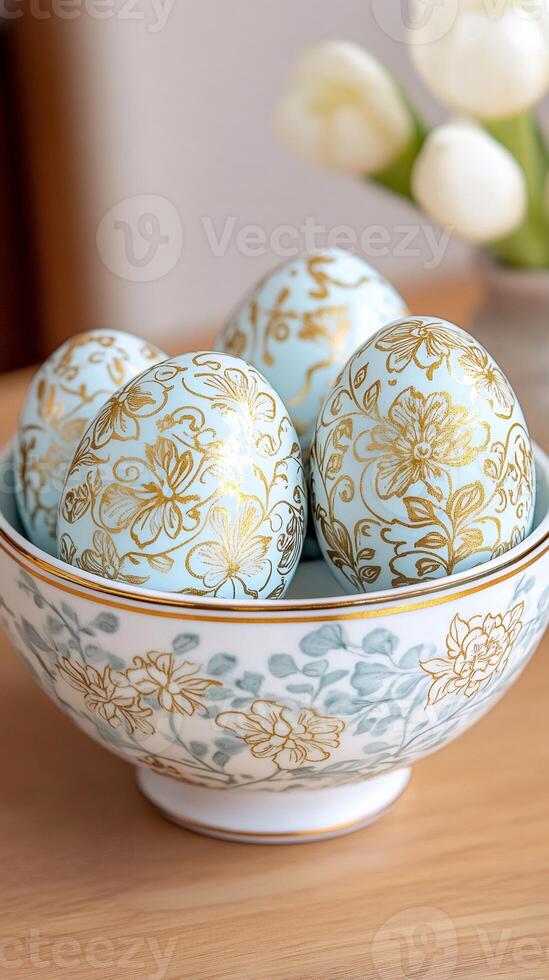 Decorated easter eggs resting in a bowl with floral pattern photo