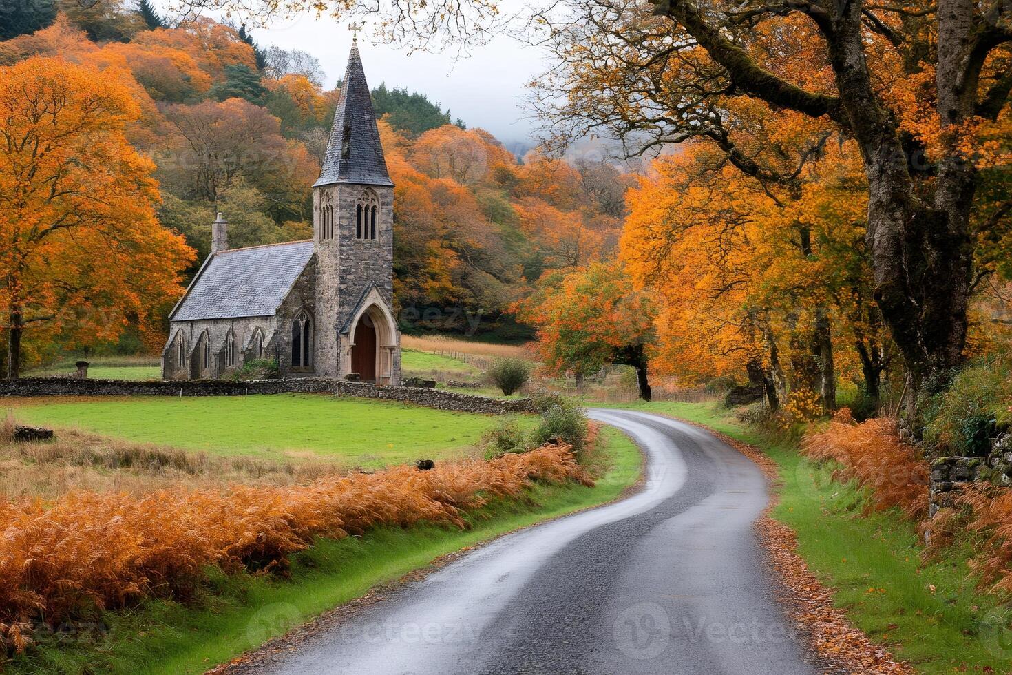 Winding road leading to a church in the colorful autumn landscape photo