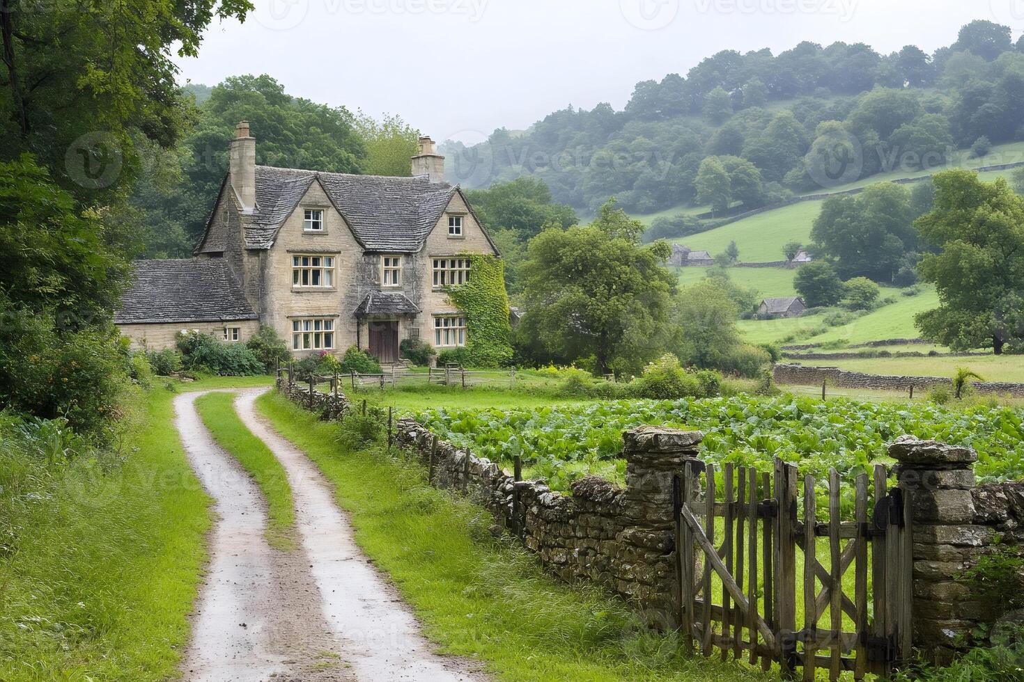 Idyllic english countryside landscape with a stone house and cultivated fields photo