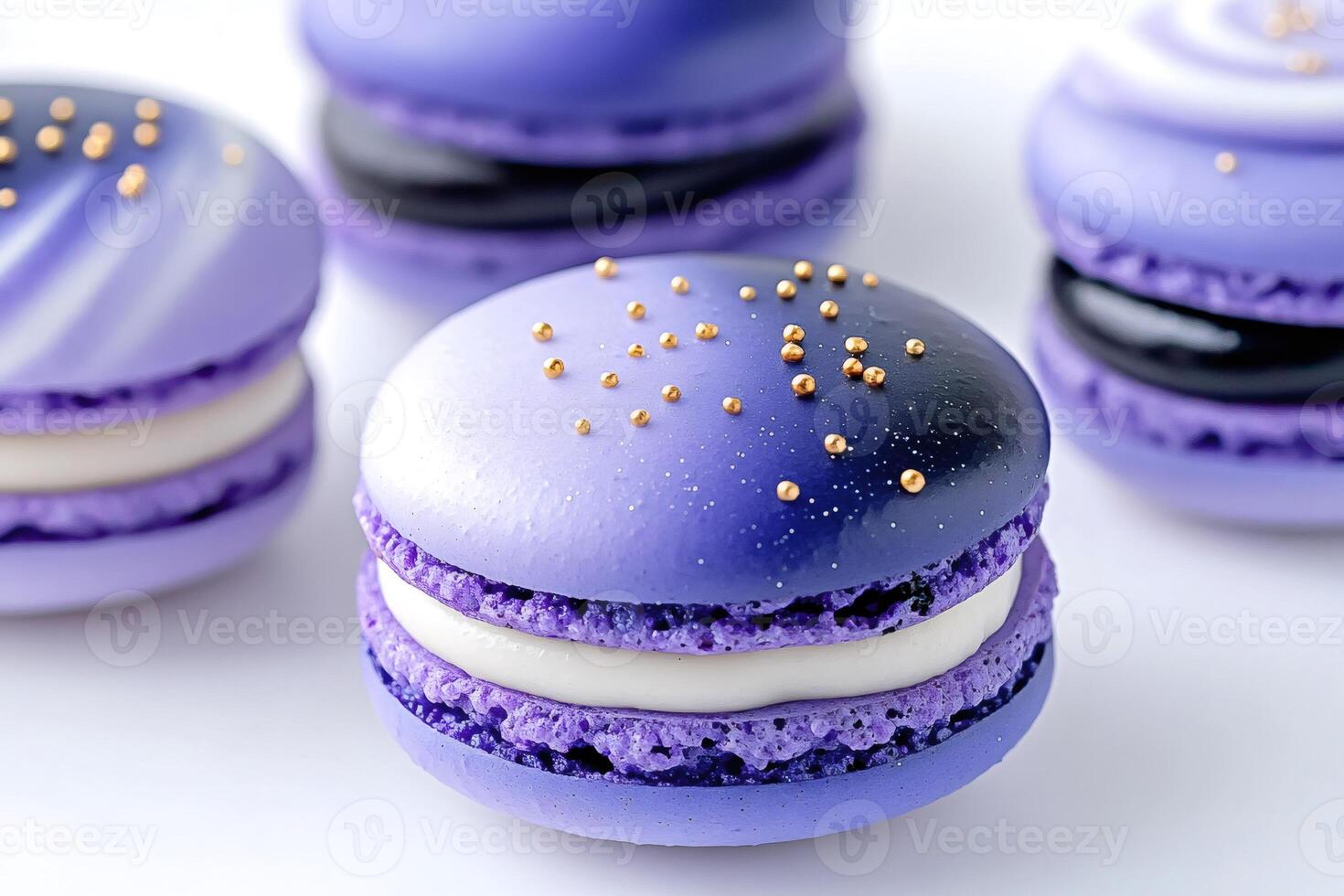 Delicious purple macarons with golden sprinkles sitting on white background photo
