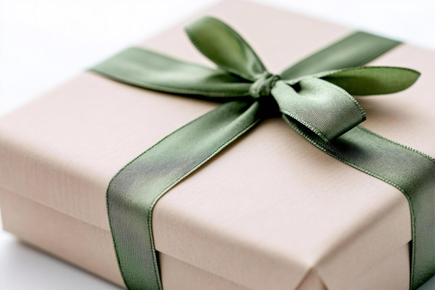 Elegant gift box wrapped in brown paper and tied with a green ribbon is waiting for a special occasion photo