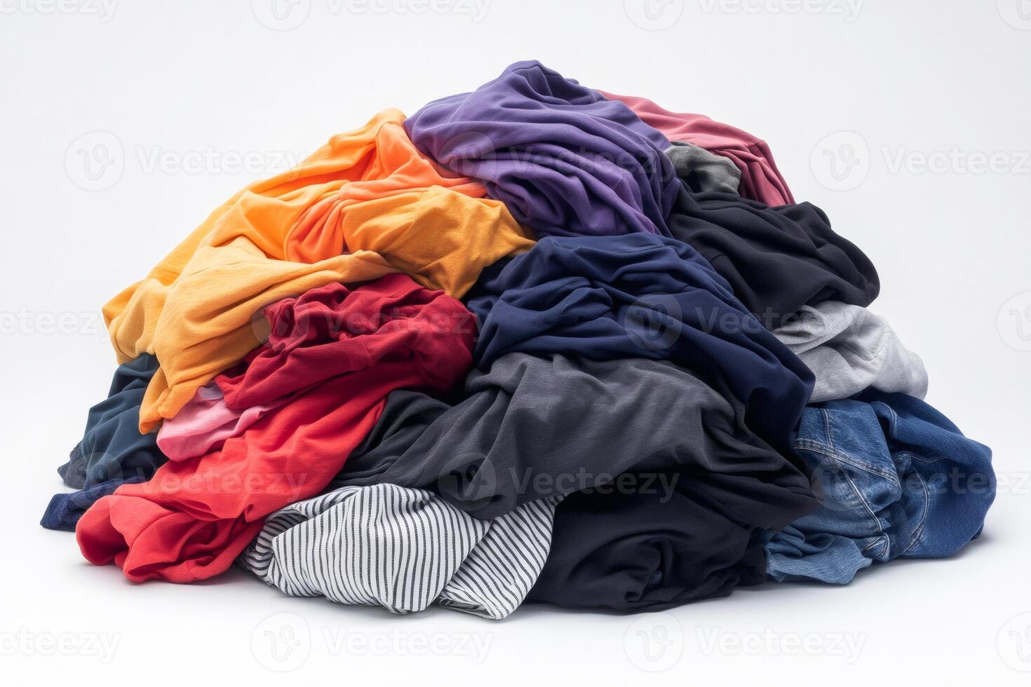 Pile of colorful crumpled clothes forming a small mountain on white background photo