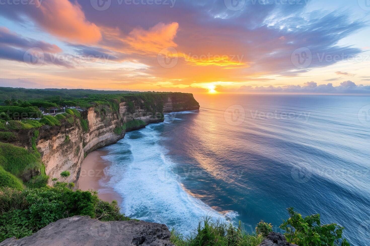 Colorful sunset over Uluwatu cliff in Bali, Indonesia photo