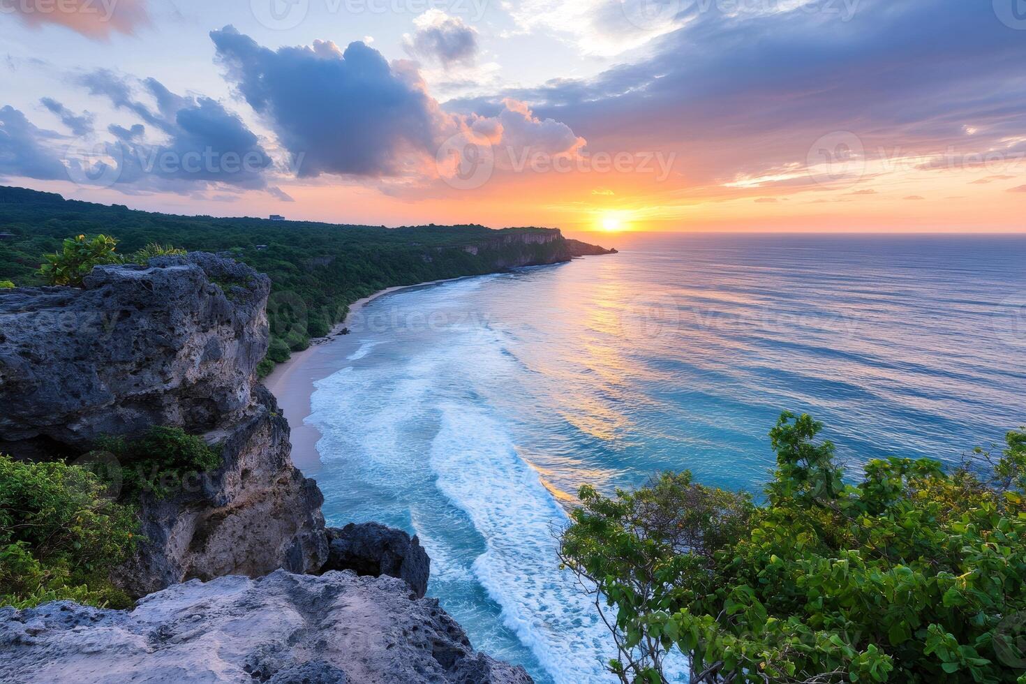 Colorful sunset over tropical beach and rocky cliffs in Bali, Indonesia photo