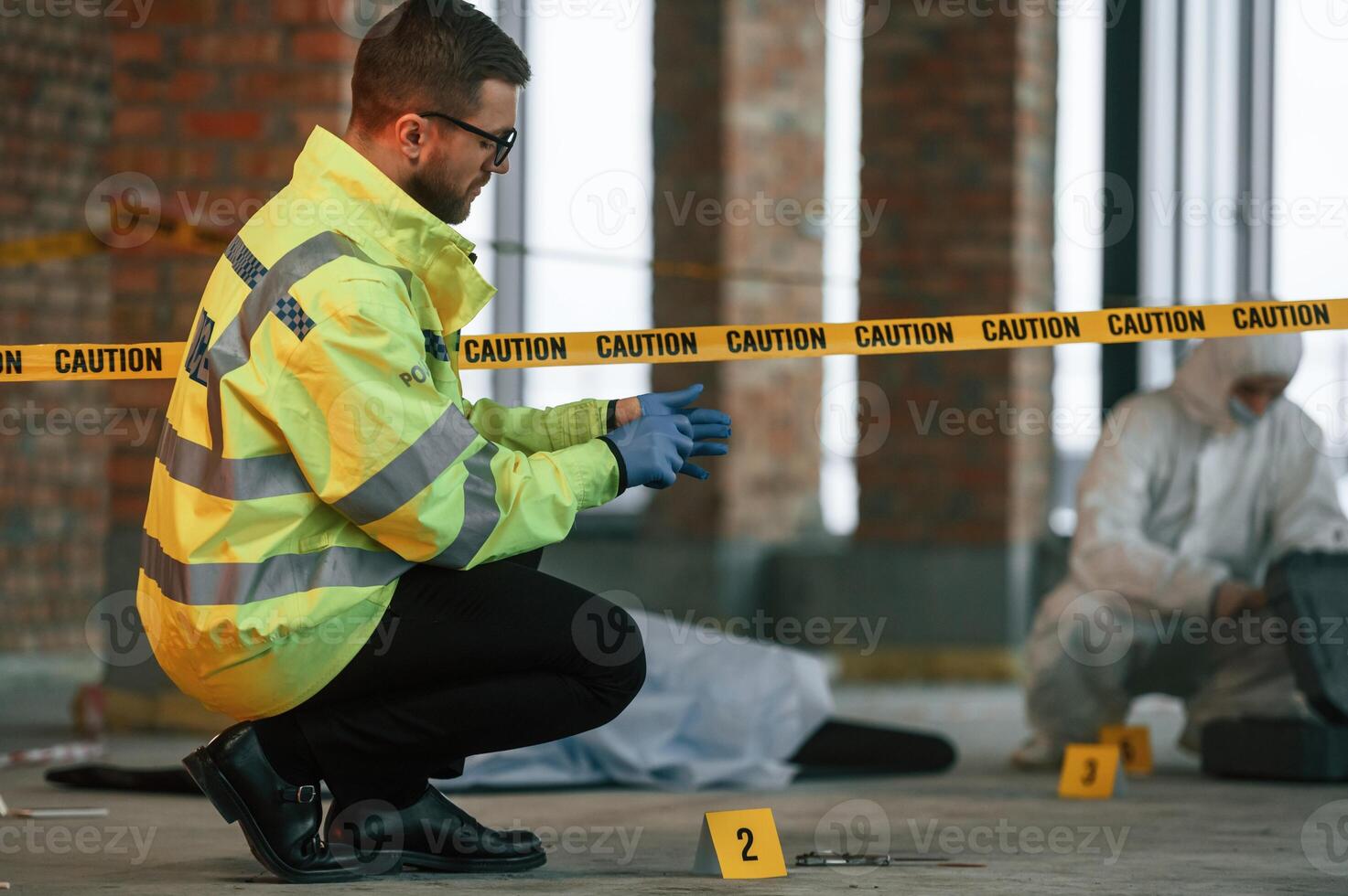 Dead body, is on the ground. Detectives are collecting evidence in a crime scene photo