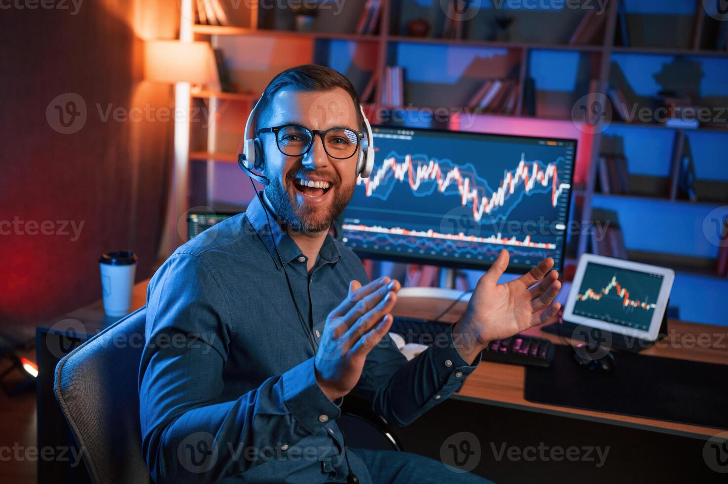 Applauds,, conception of success. Stock trader is working by pc indoors. Conception of exchange and money photo