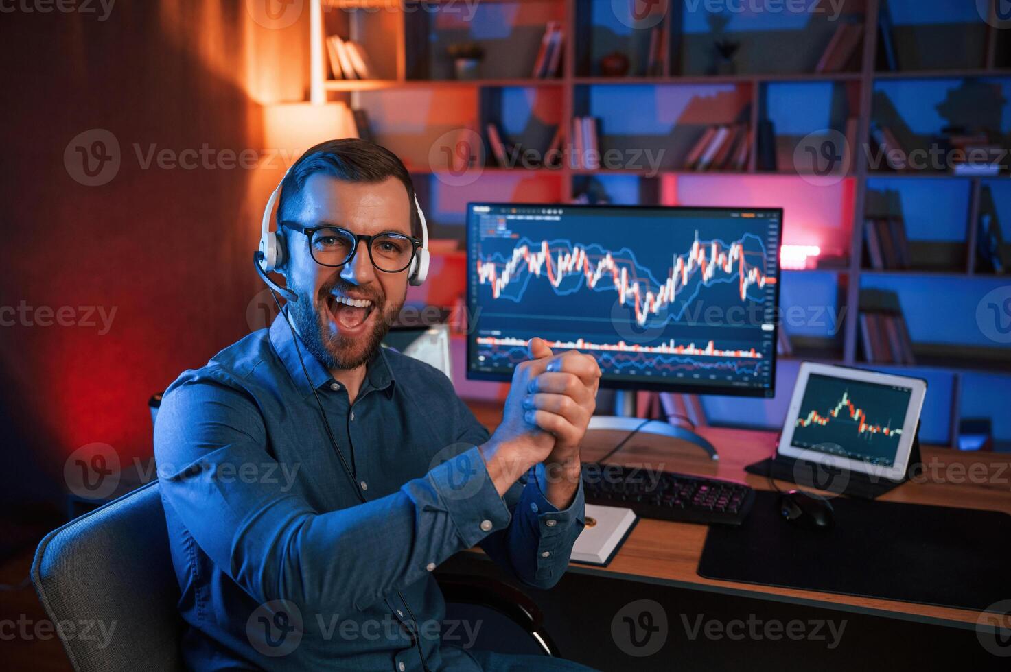 Applauds, conception of success.. Stock trader is working by pc indoors. Conception of exchange and money photo