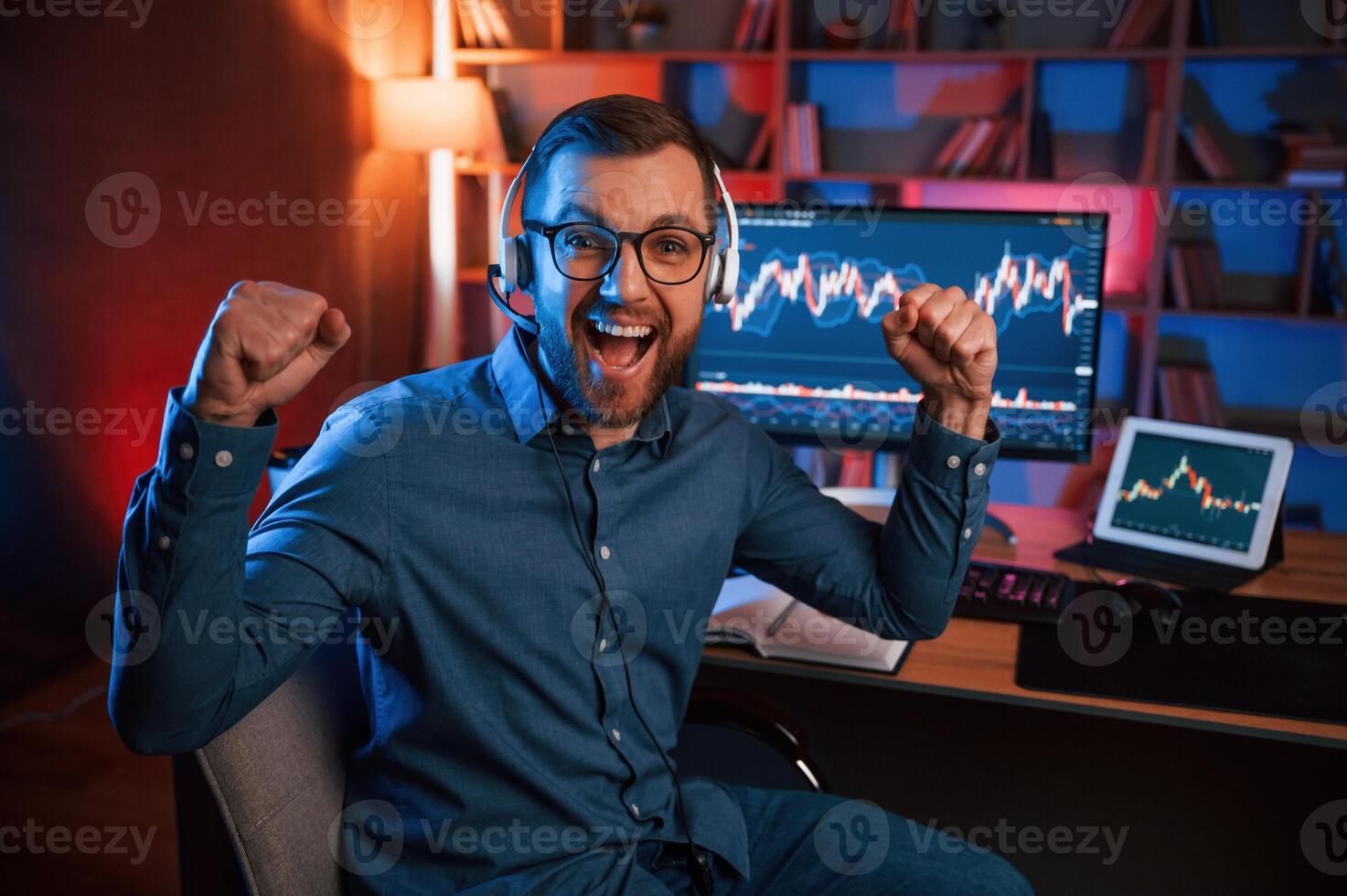 Happy stock, trader is working ,by pc indoors and celebrating success. Conception of exchange and money photo