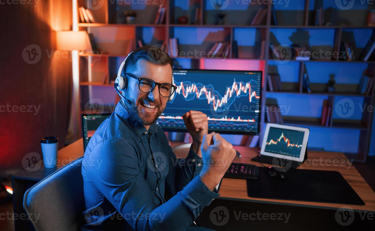 Happy, stock,, trader is working by pc indoors and celebrating success. Conception of exchange and money photo