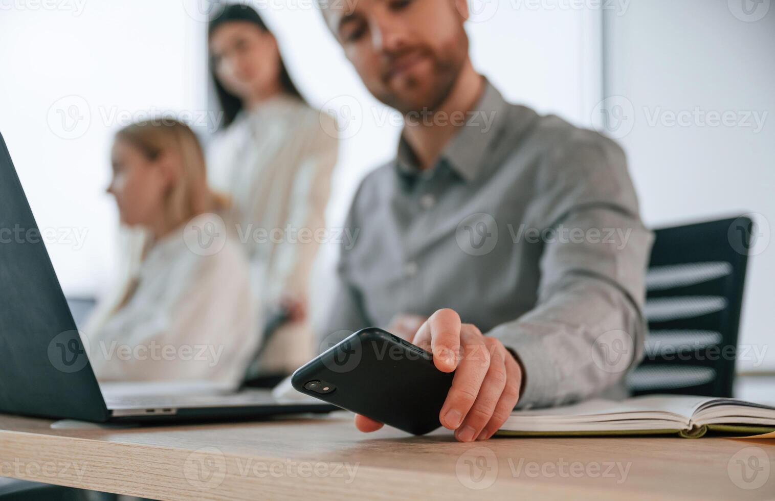 Working ,on a project together. Successful team are in the office. Conception of business photo