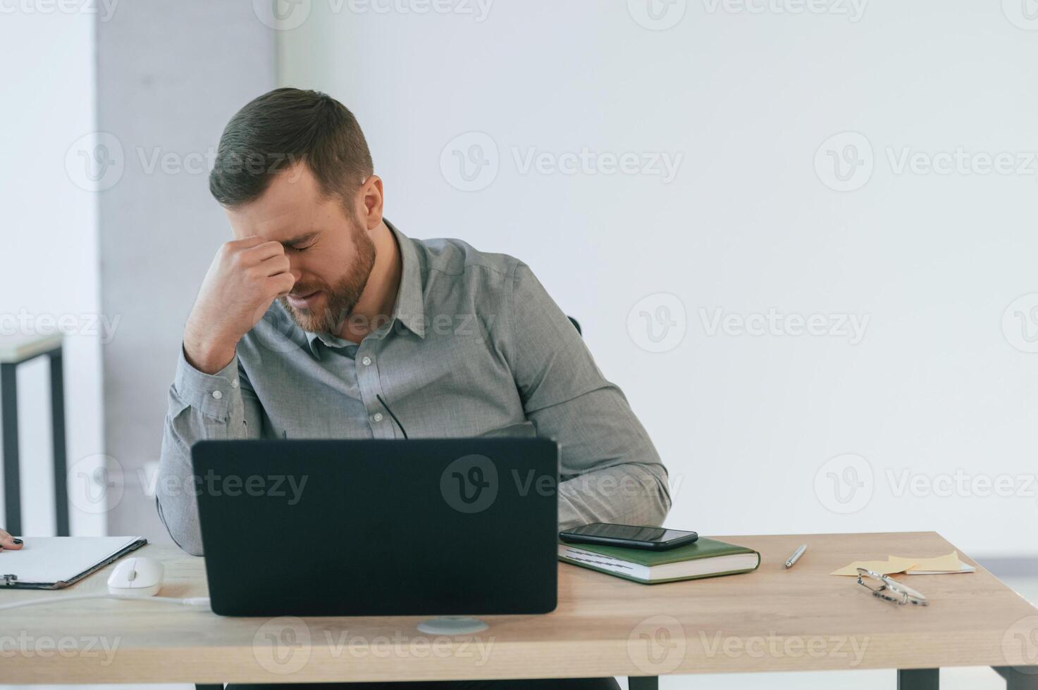 Bad ,result, failure, having headache. Businessman in formal clothes is working in the office photo