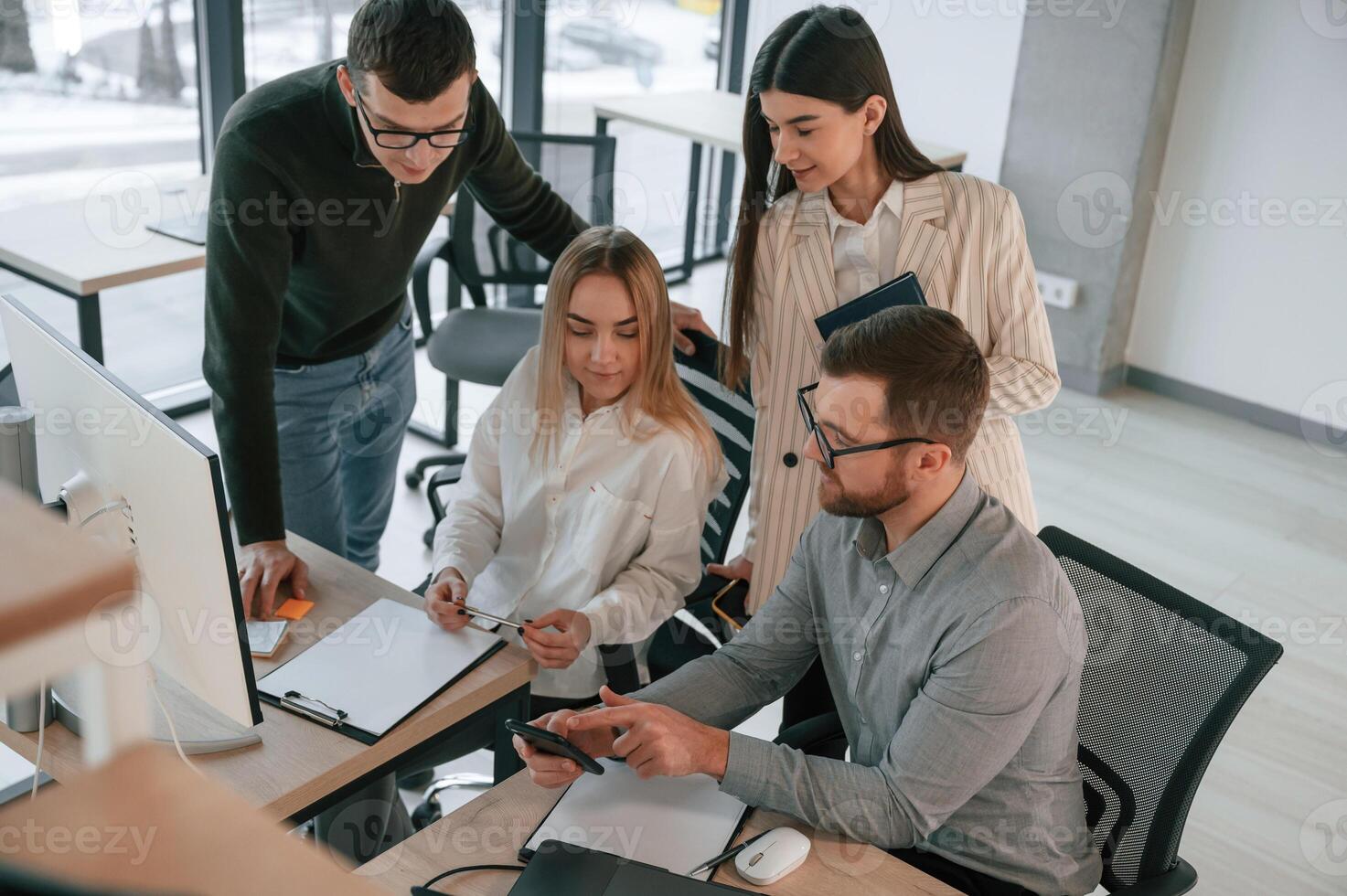 Having conversation about ideas... Successful team are working together in the office. Conception of business photo