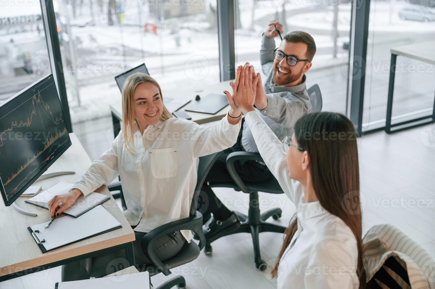 Doing ,high five. Successful ,team are working together in the office. Conception of business photo