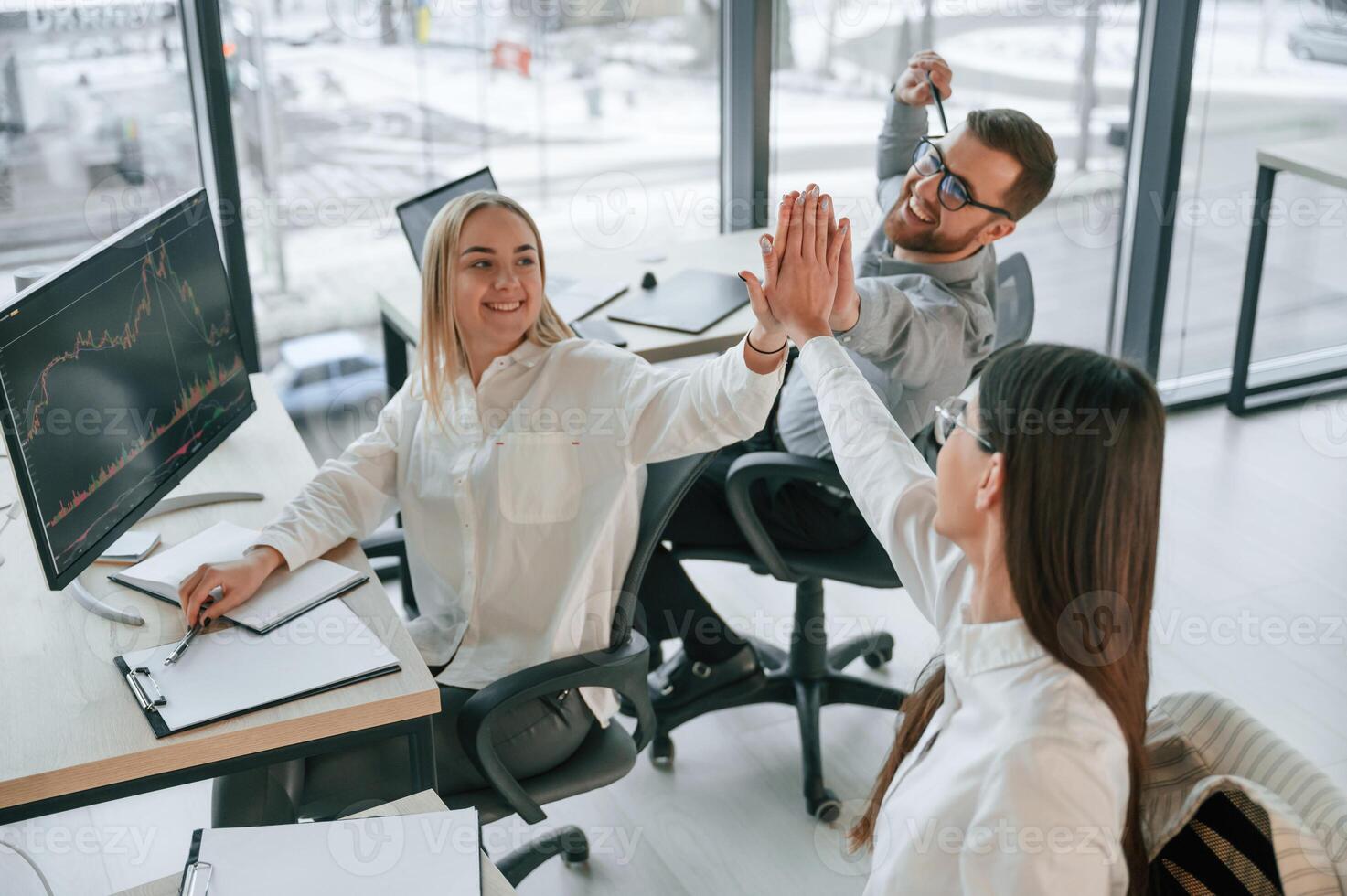 Doing, high five.. Successful team are working together in the office. Conception of business photo