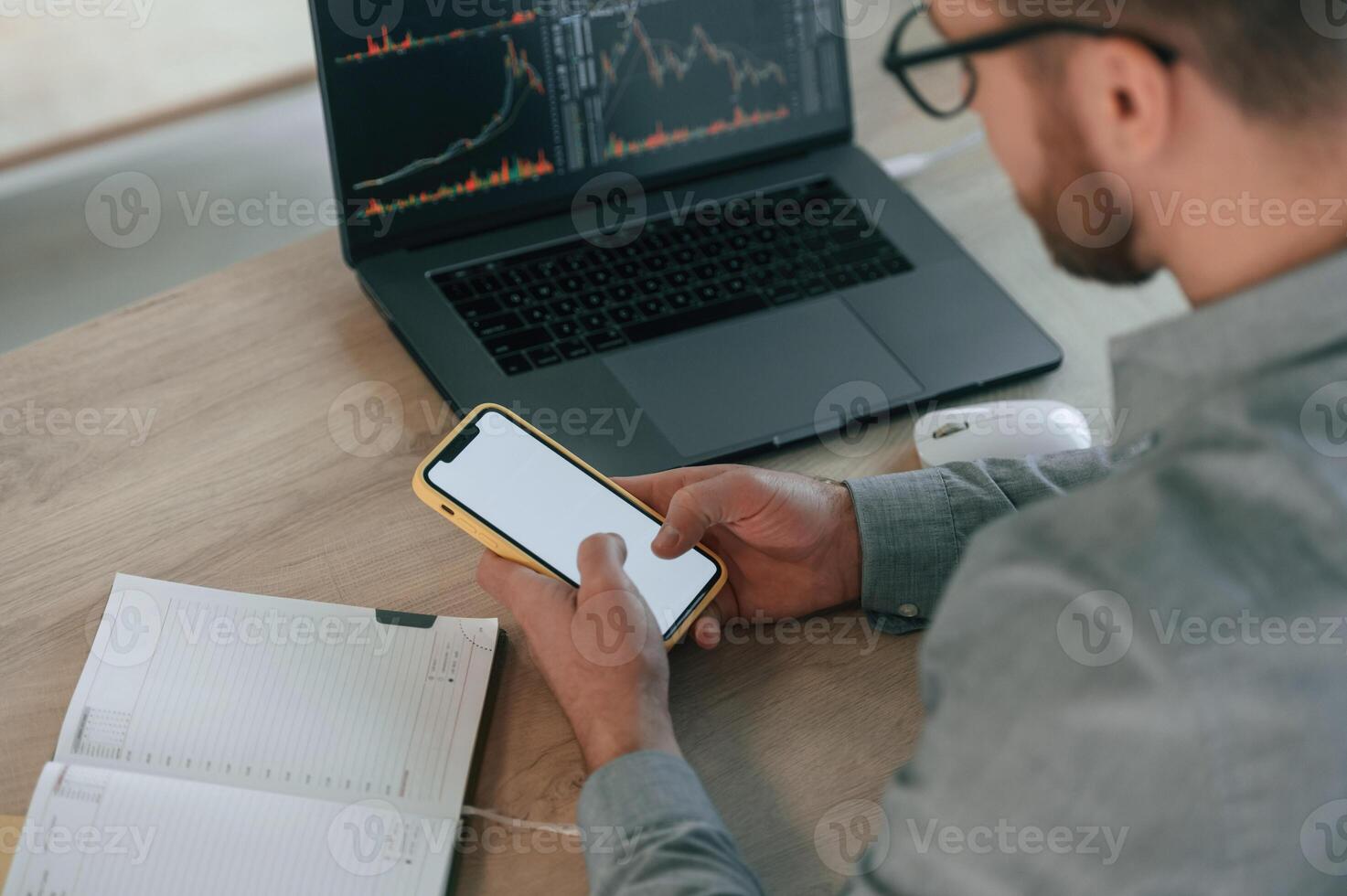 Using smartphone. Businessman in ,formal clothes is working in the office photo