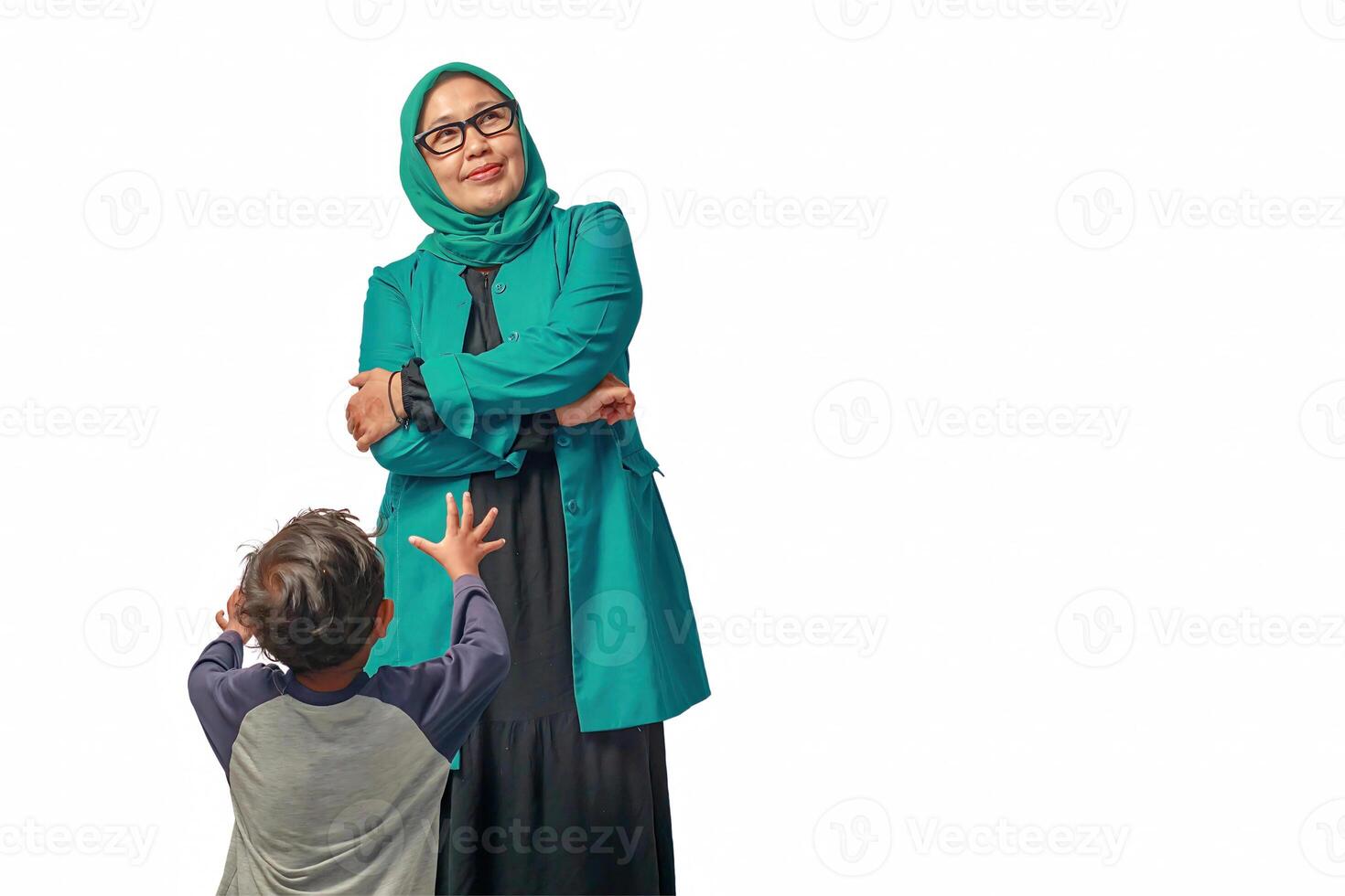 Senior Muslim Woman Ignoring a Child Reaching Out photo