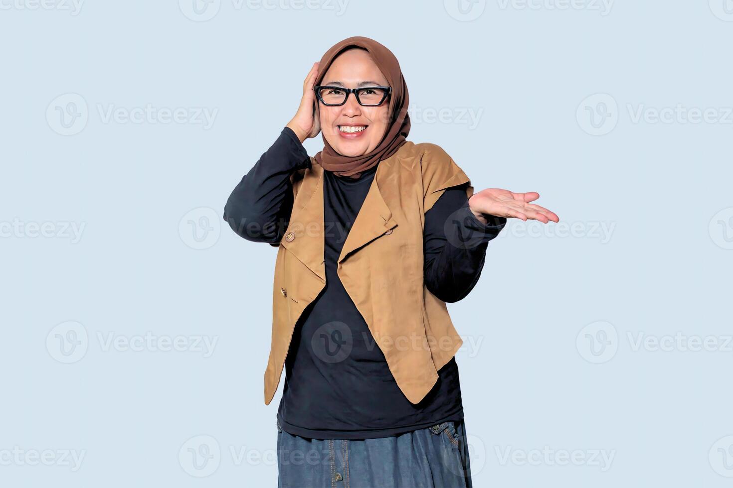 A joyful Muslim woman wearing a hijab, showing a happy and confident expression photo