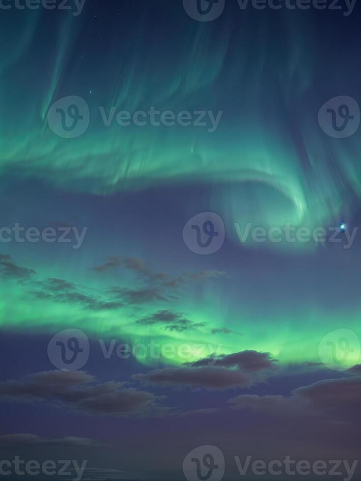 Northern lights Aurora borealis in the night sky. Dancing Aurora photo