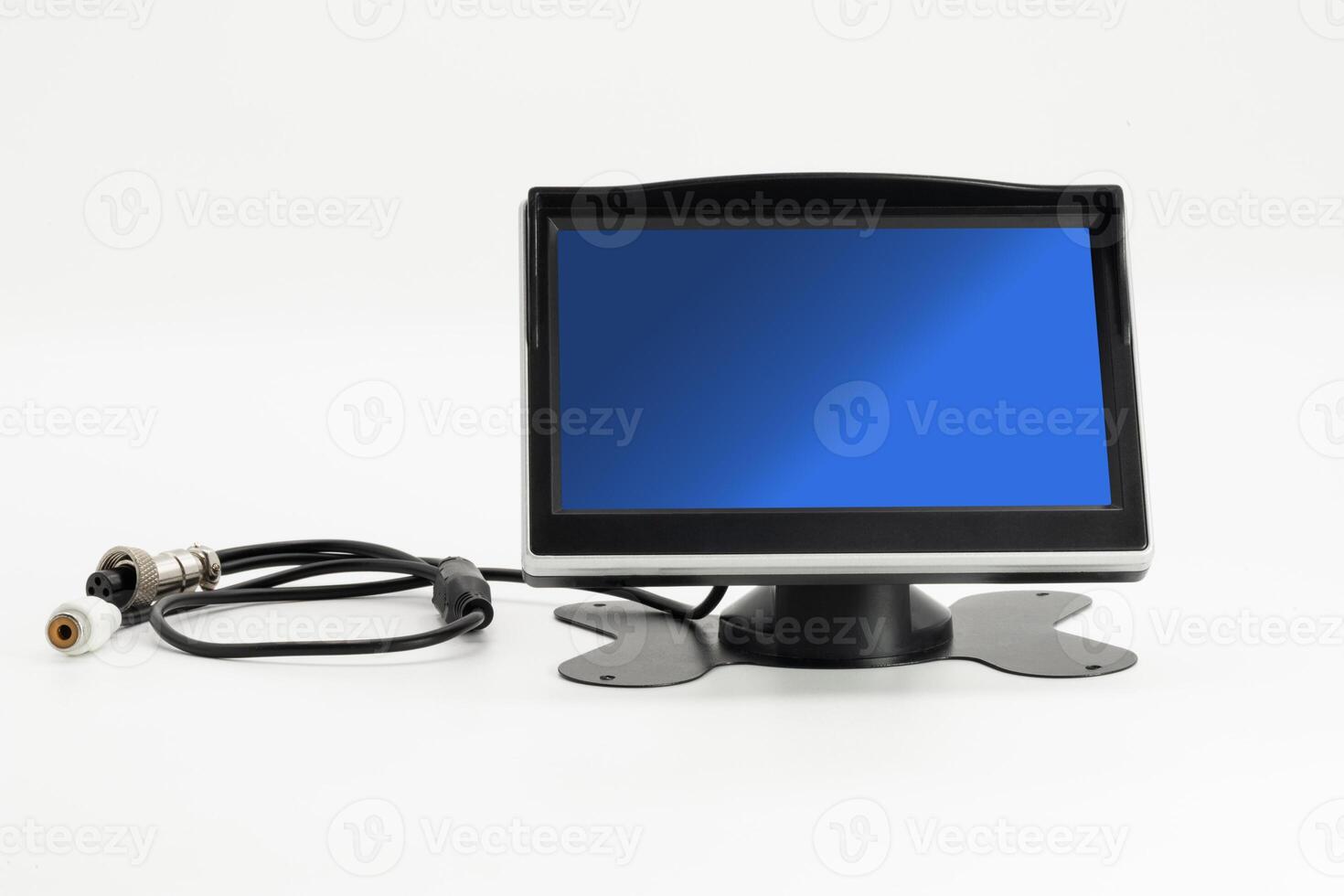 Dashboard monitor with stand and cable setup for enhanced visual display in vehicle photo