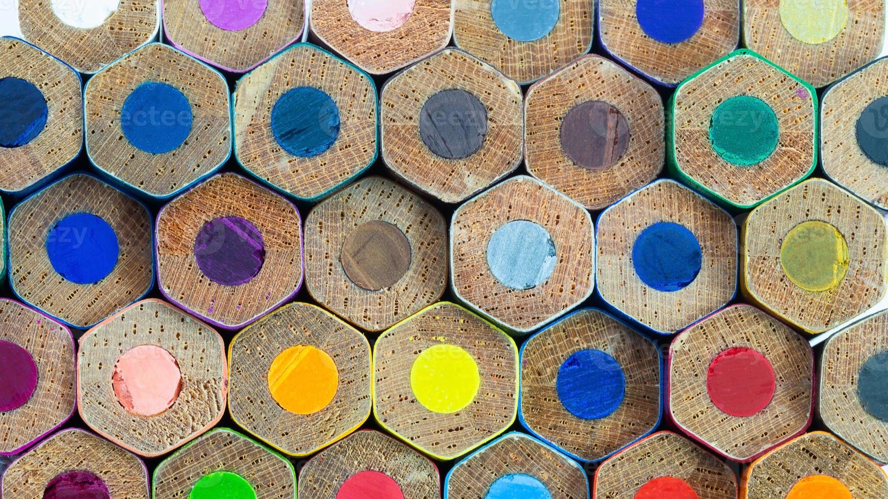 Colorful hexagonal color pencil pattern arranged neatly on a surface showcasing vibrant shades photo