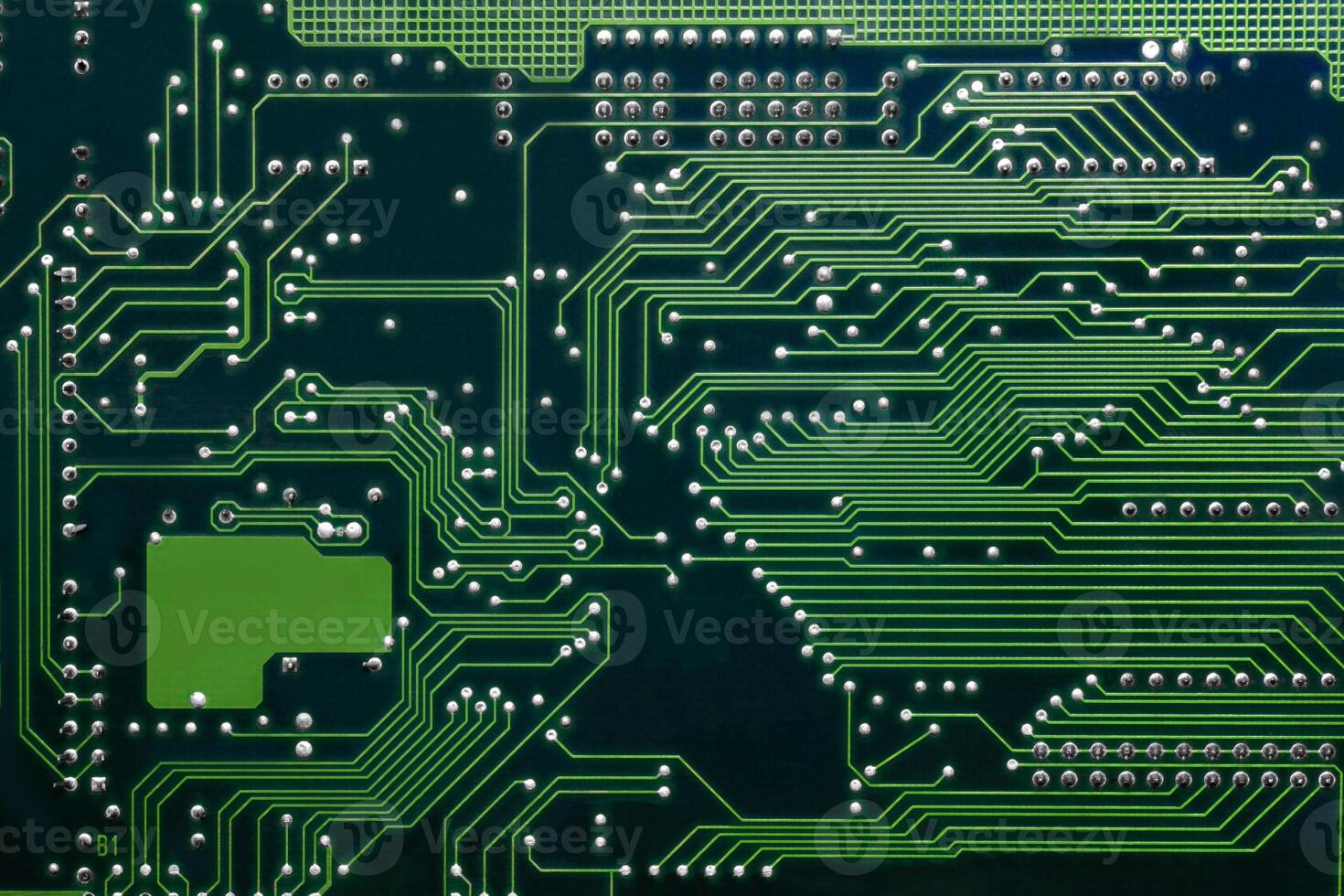 Intricate textures on a detailed circuit board design showcasing connection pathways photo