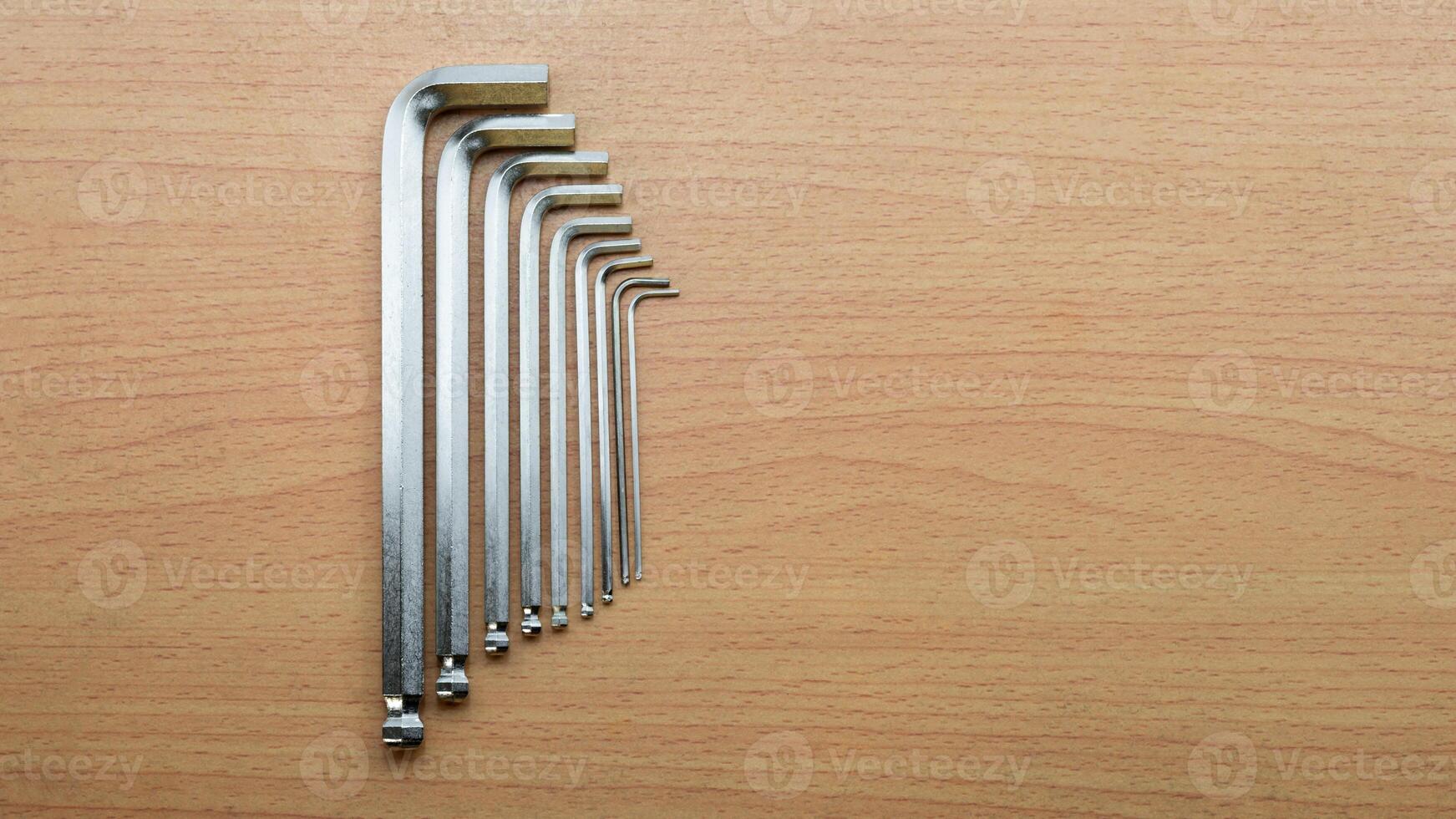 Hex wrench set arranged neatly on a wooden surface showcasing tools for precision tasks photo