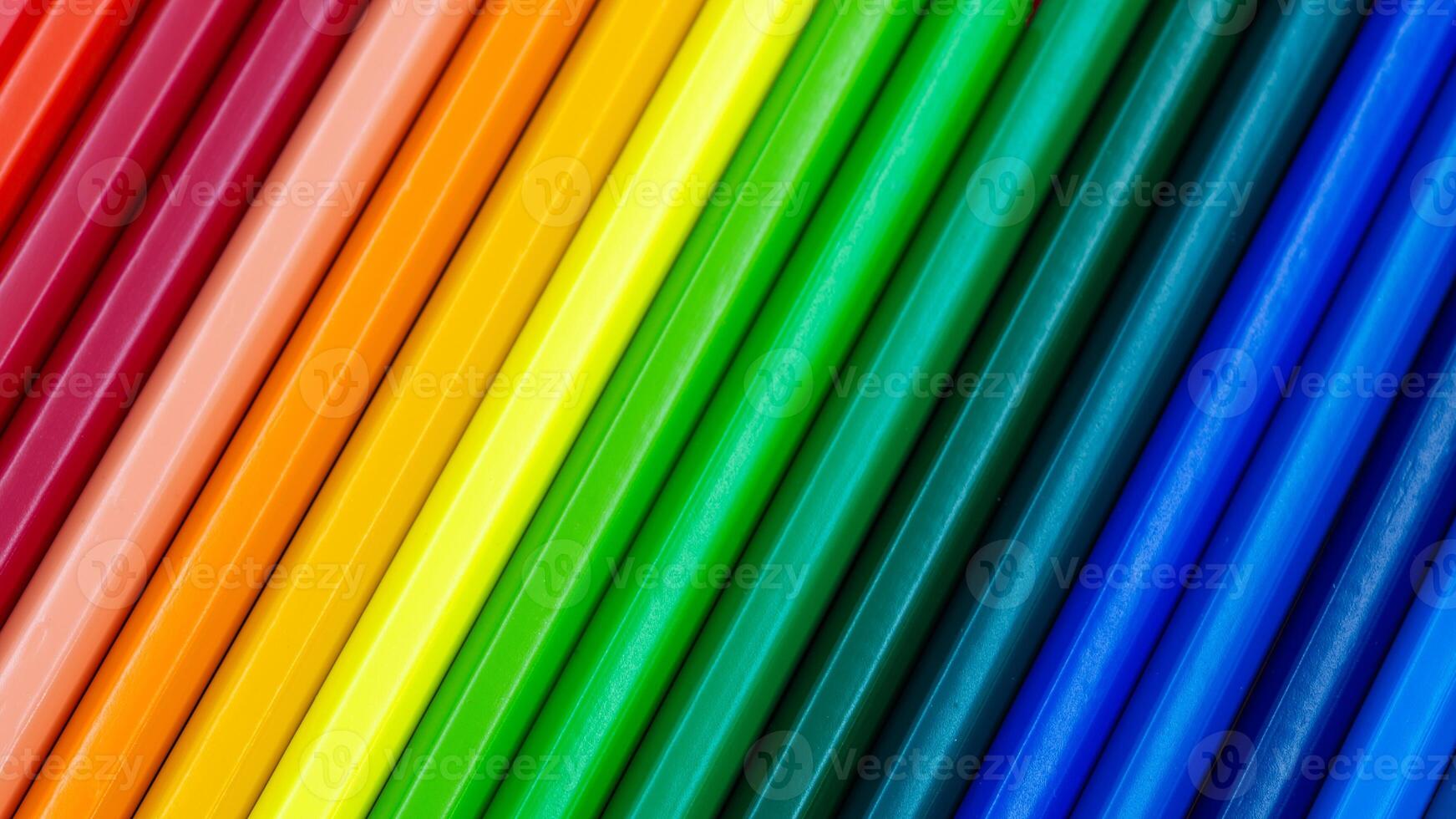 Color Pencils Arranged Diagonally Creating a Rainbow Spectrum photo