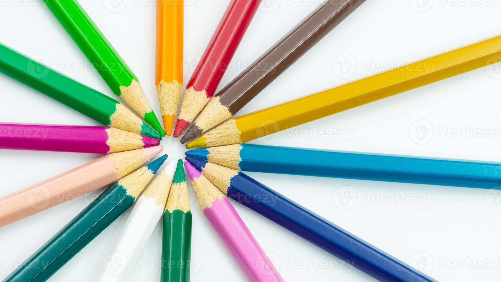 Circular arrangement of colored pencils showcasing vibrant hues in a creative layout photo