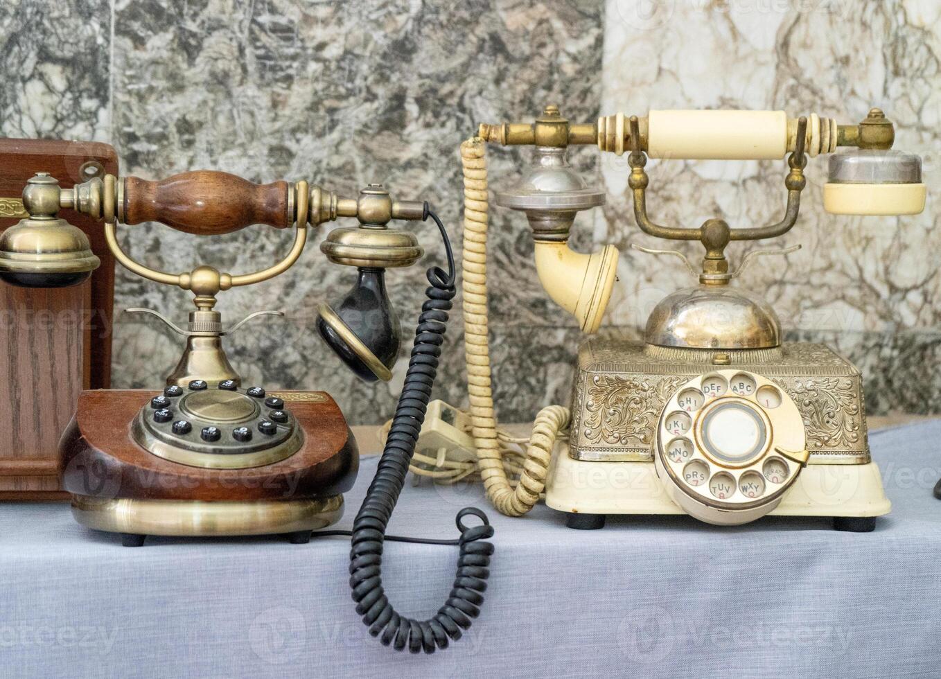 Old phone. A disk with numbers, a tube on a wire. First prototype. photo