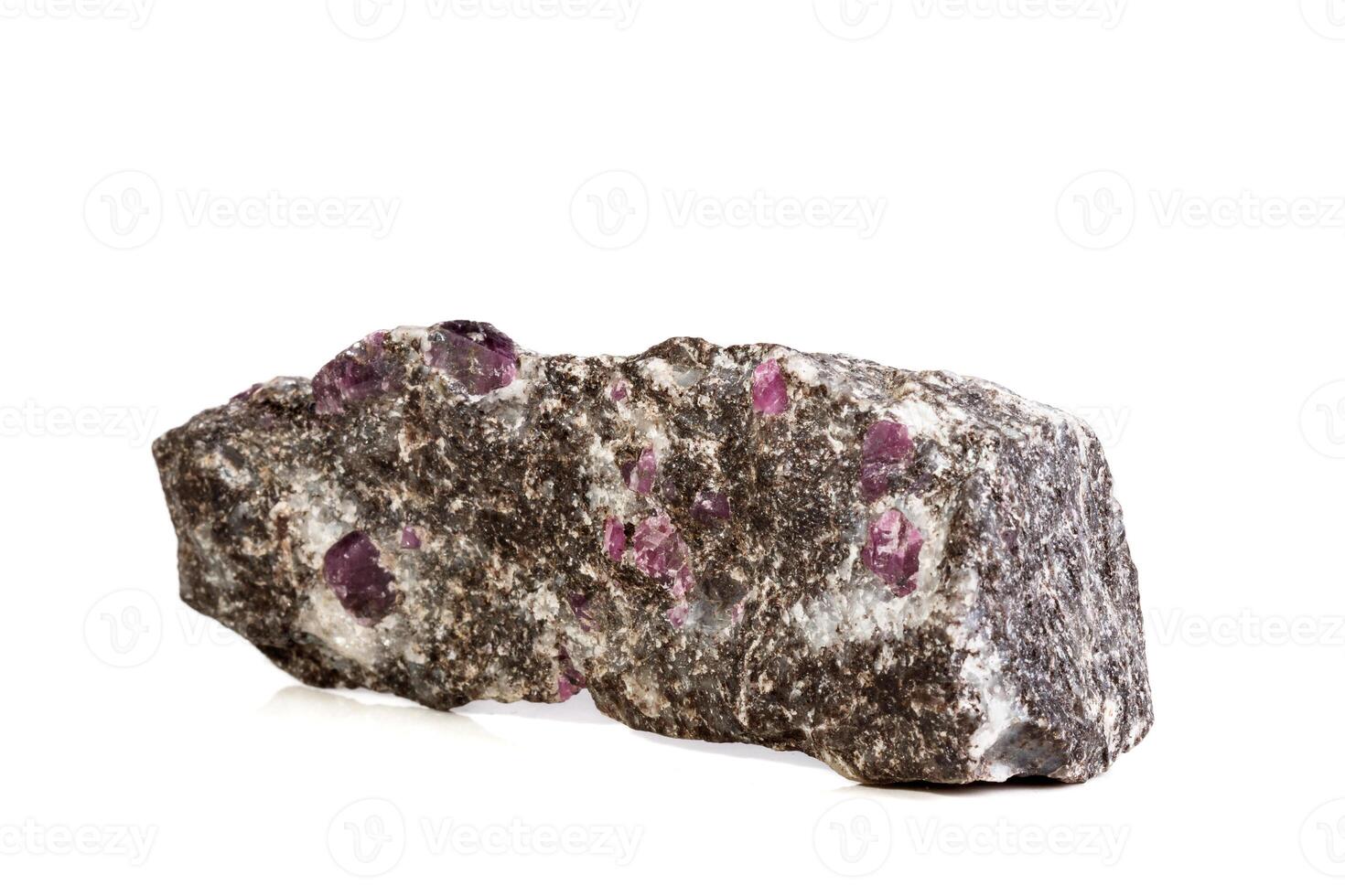 close-up Macro of a mineral Ruby stone on a white background photo