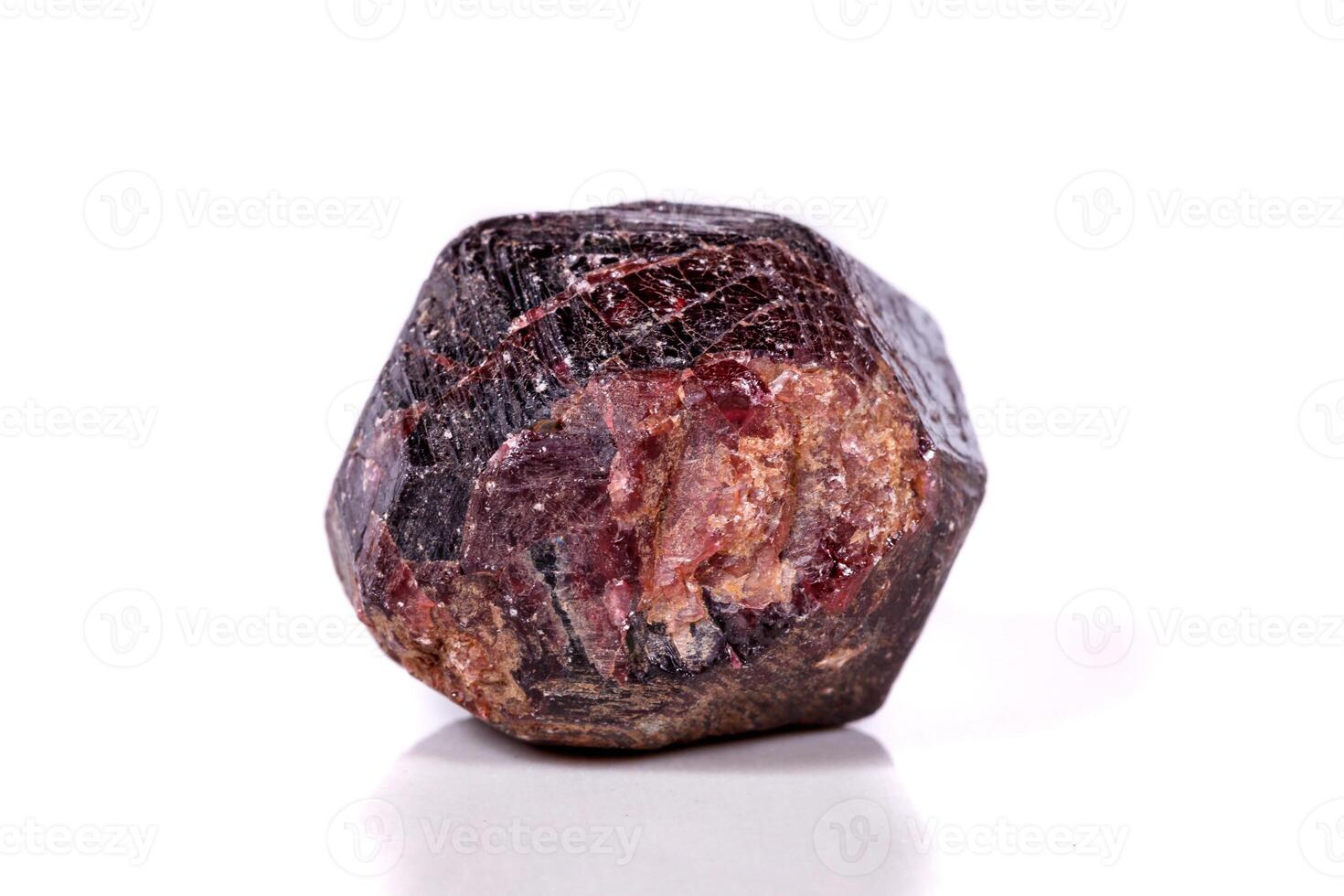 close-up Macro of a mineral garnet stone on a white background photo