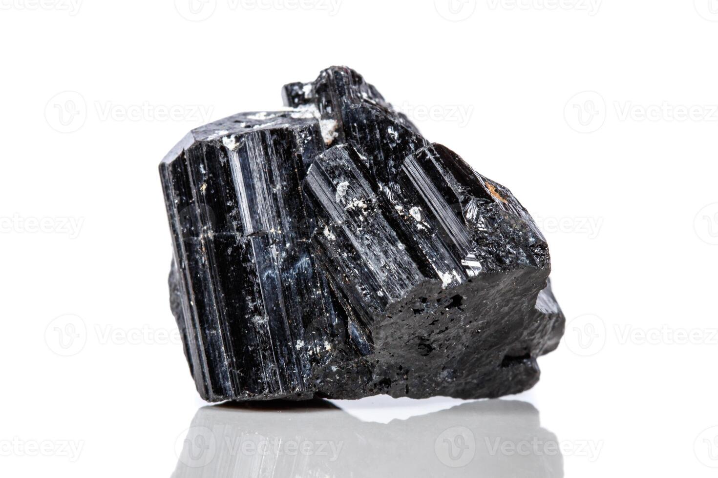 close-up macro mineral stone sherle, black tourmaline on white background photo