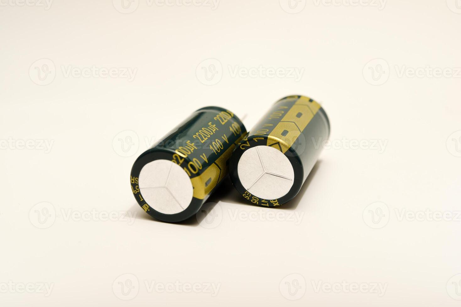 Polarized capacitors displayed against a clean white surface. Essential elements for powering electronic gadgets. photo