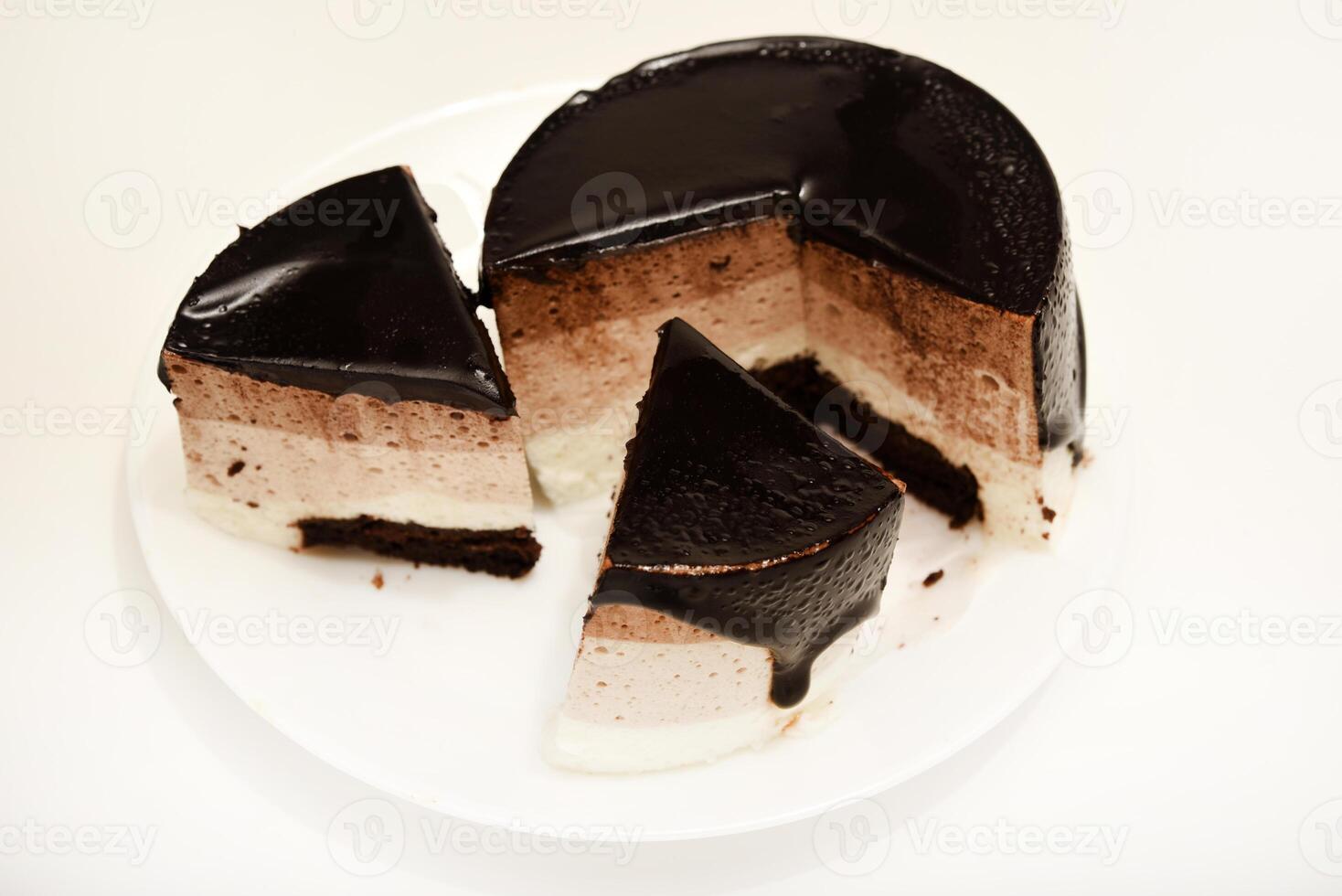 Velvety Coffee Cream Cheesecake. A cake with cheese and chocolate on a plate. photo