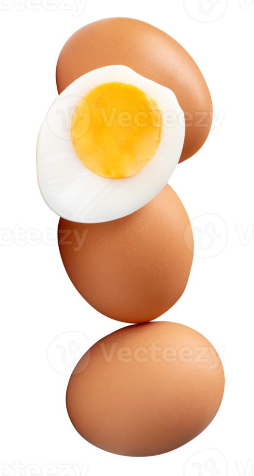 A group of raw brown chicken eggs and cooked or boiled chicken egg with egg yolk in half in pile or stack isolated with clipping path in file format png