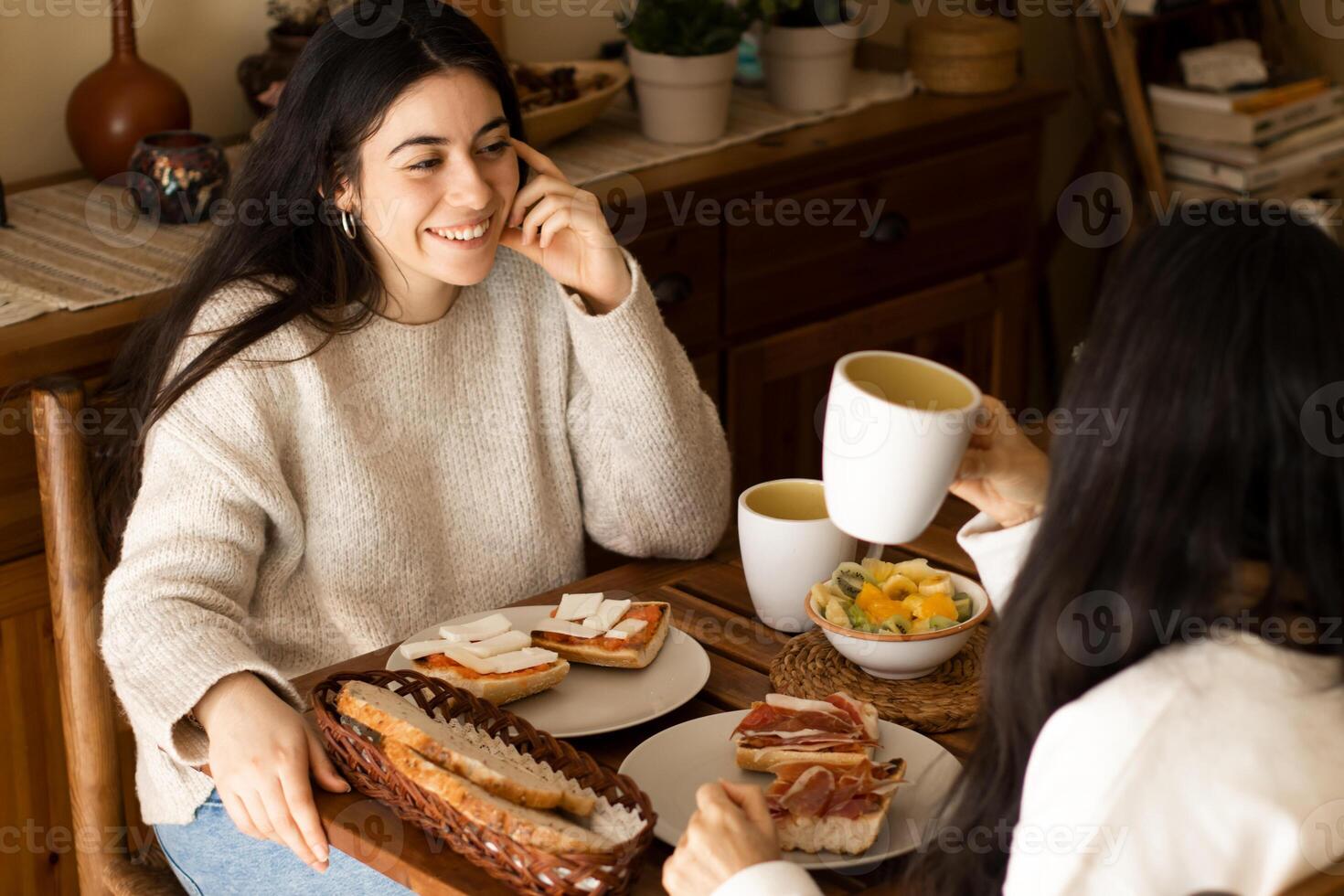 Two women sitting at a table photo