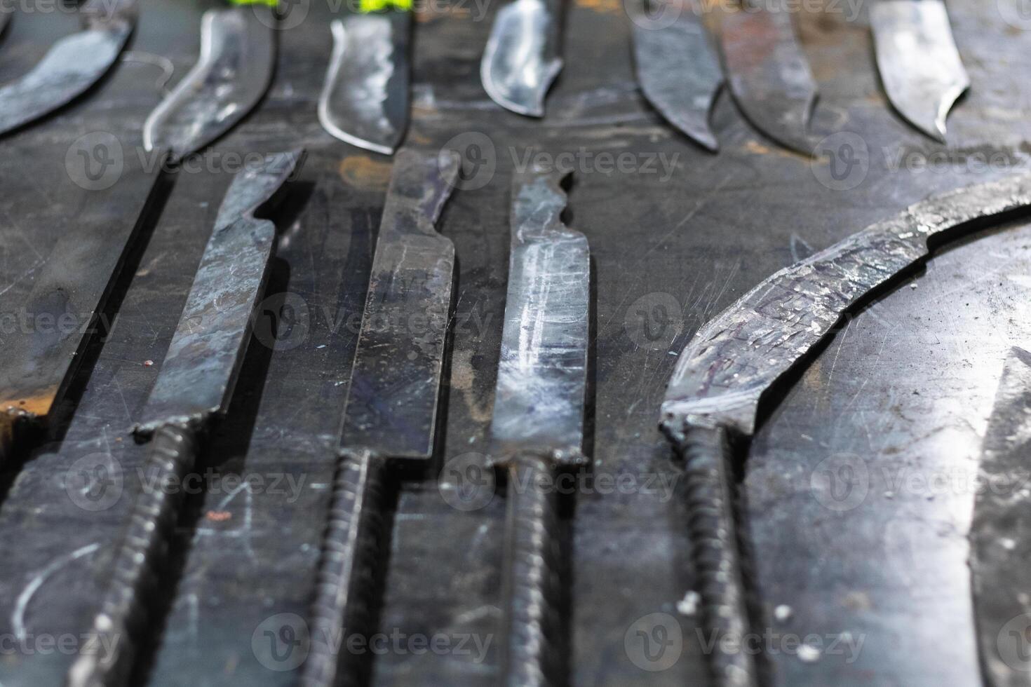 A bunch of knives on a table photo