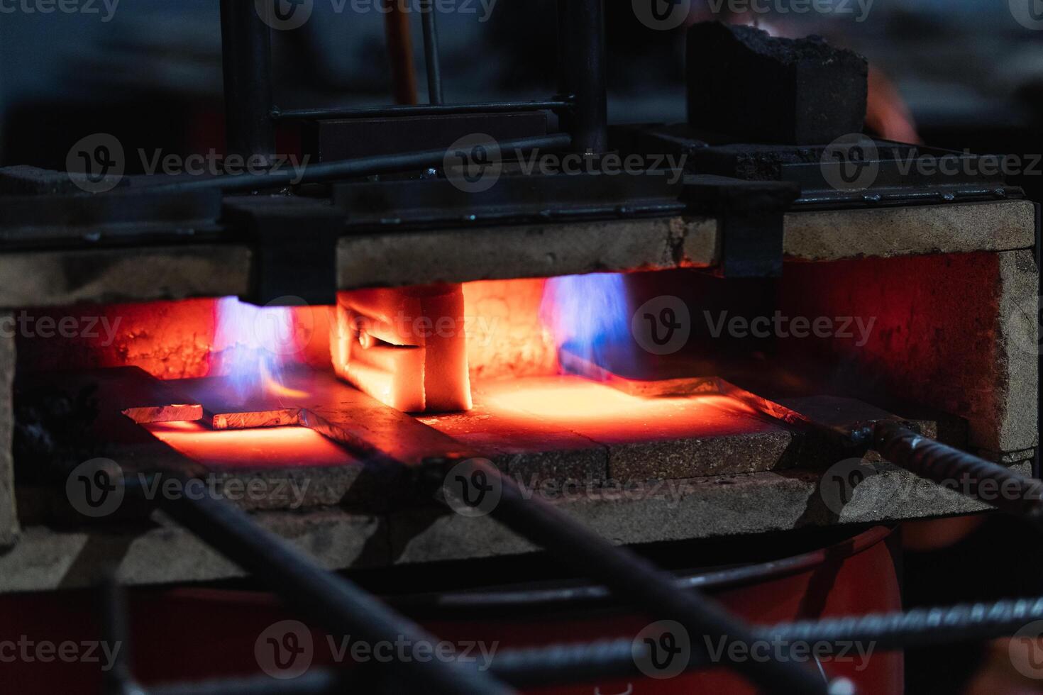 A furnace is being used to melt metal photo