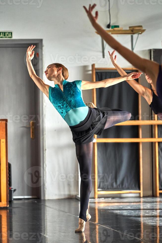 Two women in a dance studio performing a dance photo