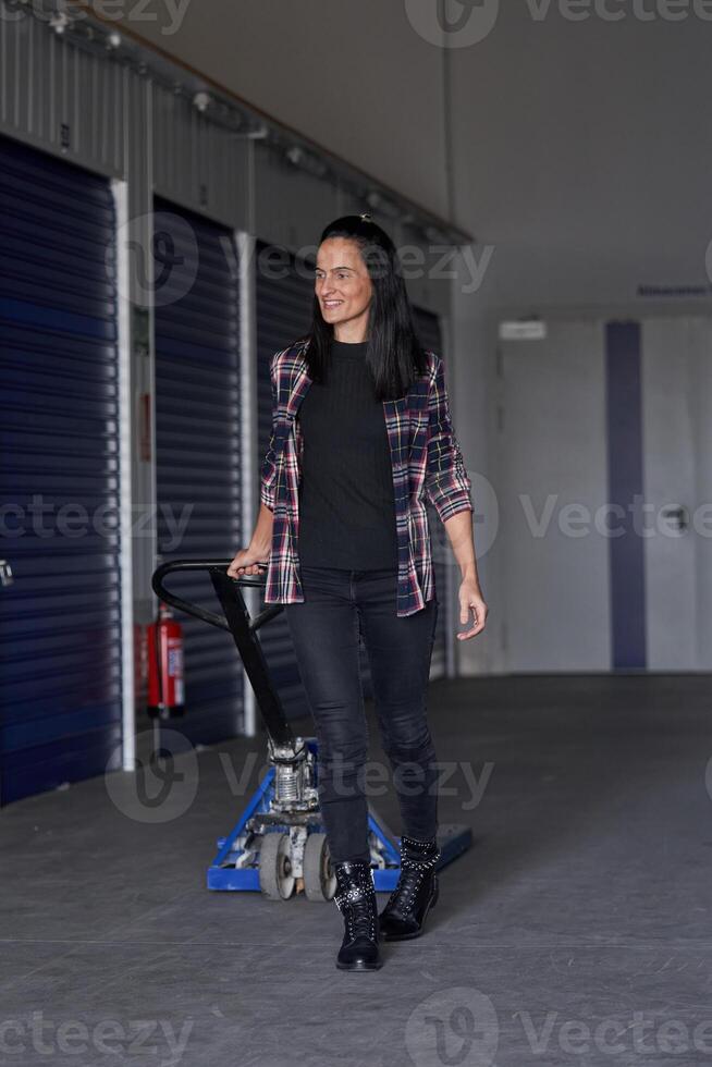 A woman walking in a storage facility photo
